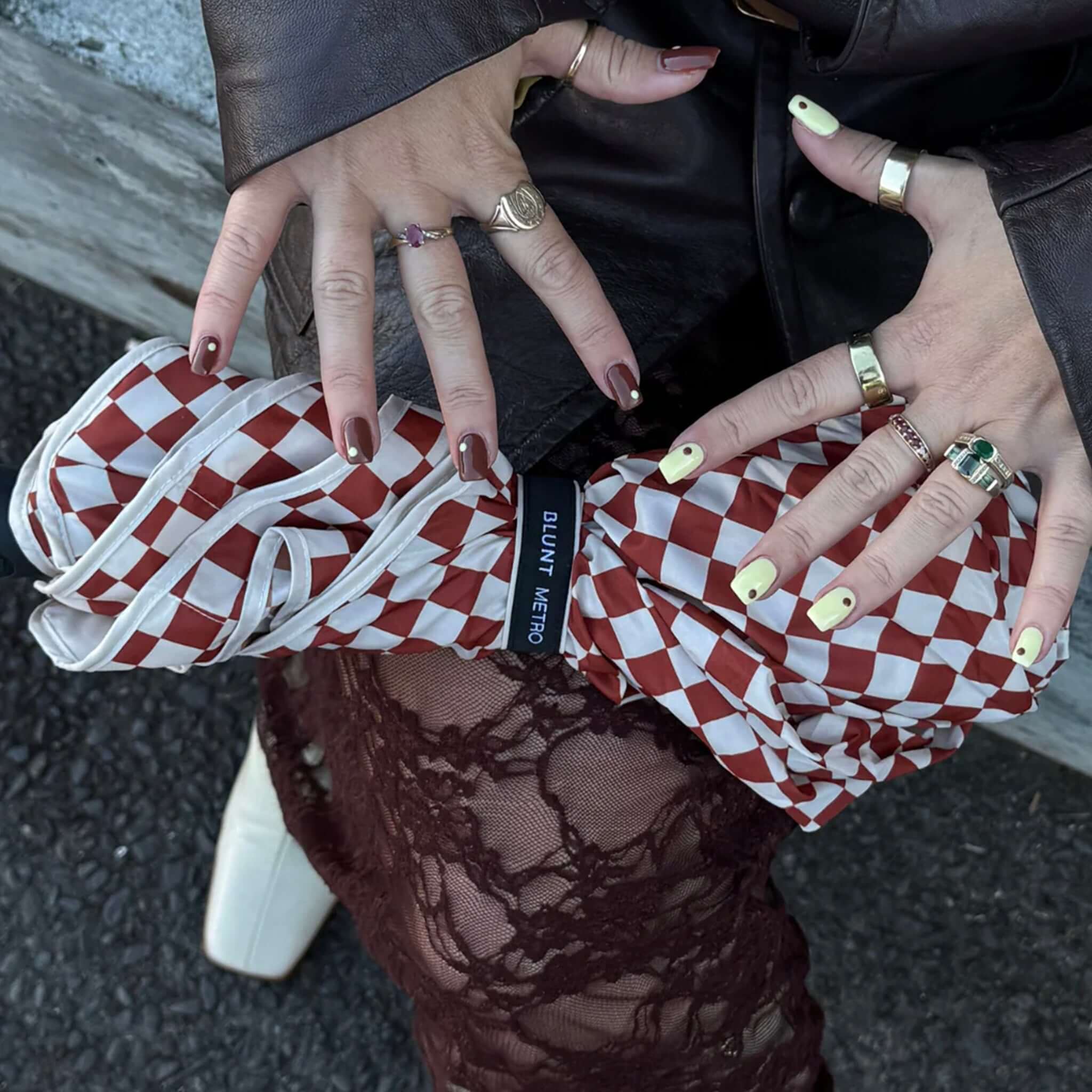 Blunt Metro Umbrella - Clay Check Limited Edition held by a person showcasing stylish hands and nails.