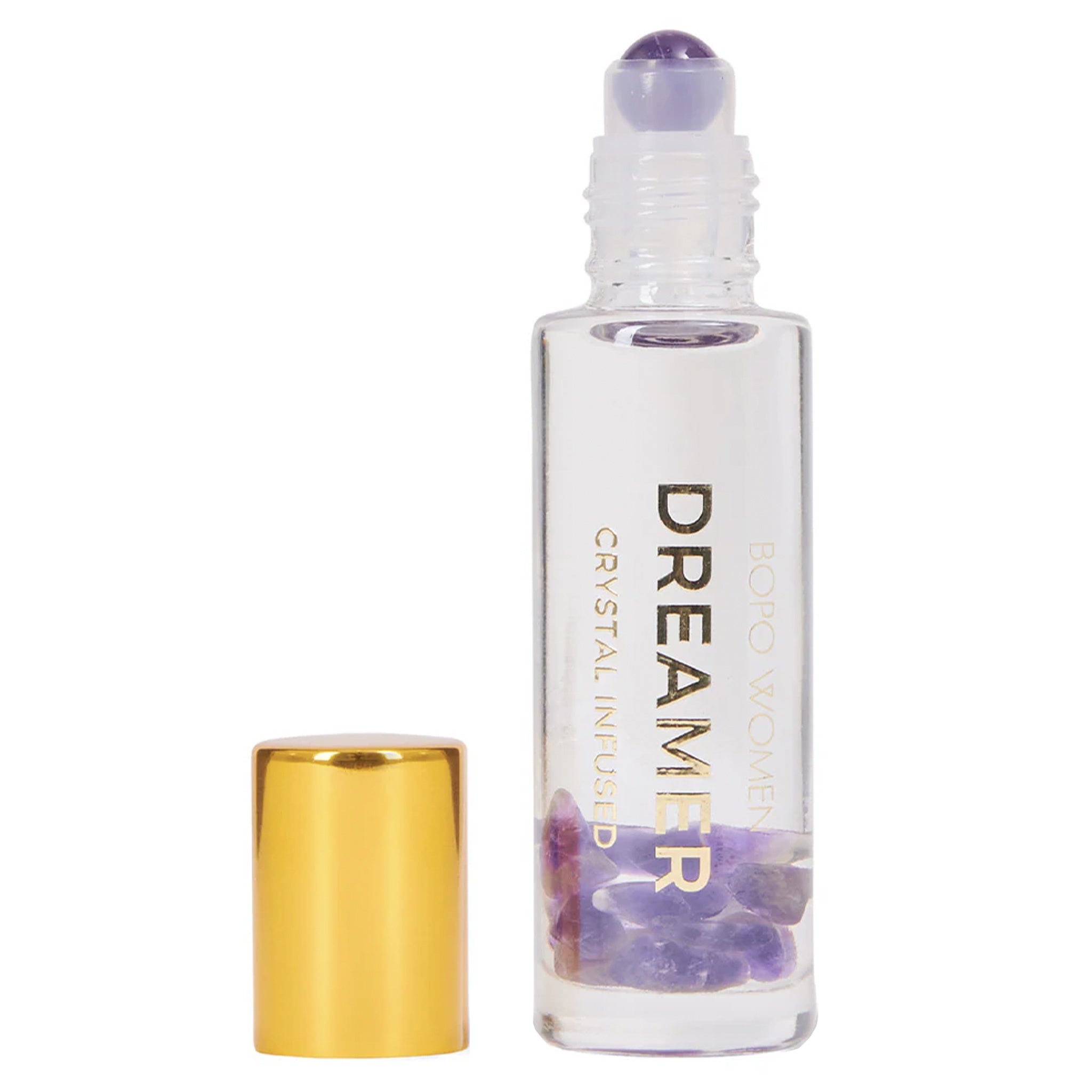 Roll-on bottle labeled 'Dreamer' with a gold cap on a white background