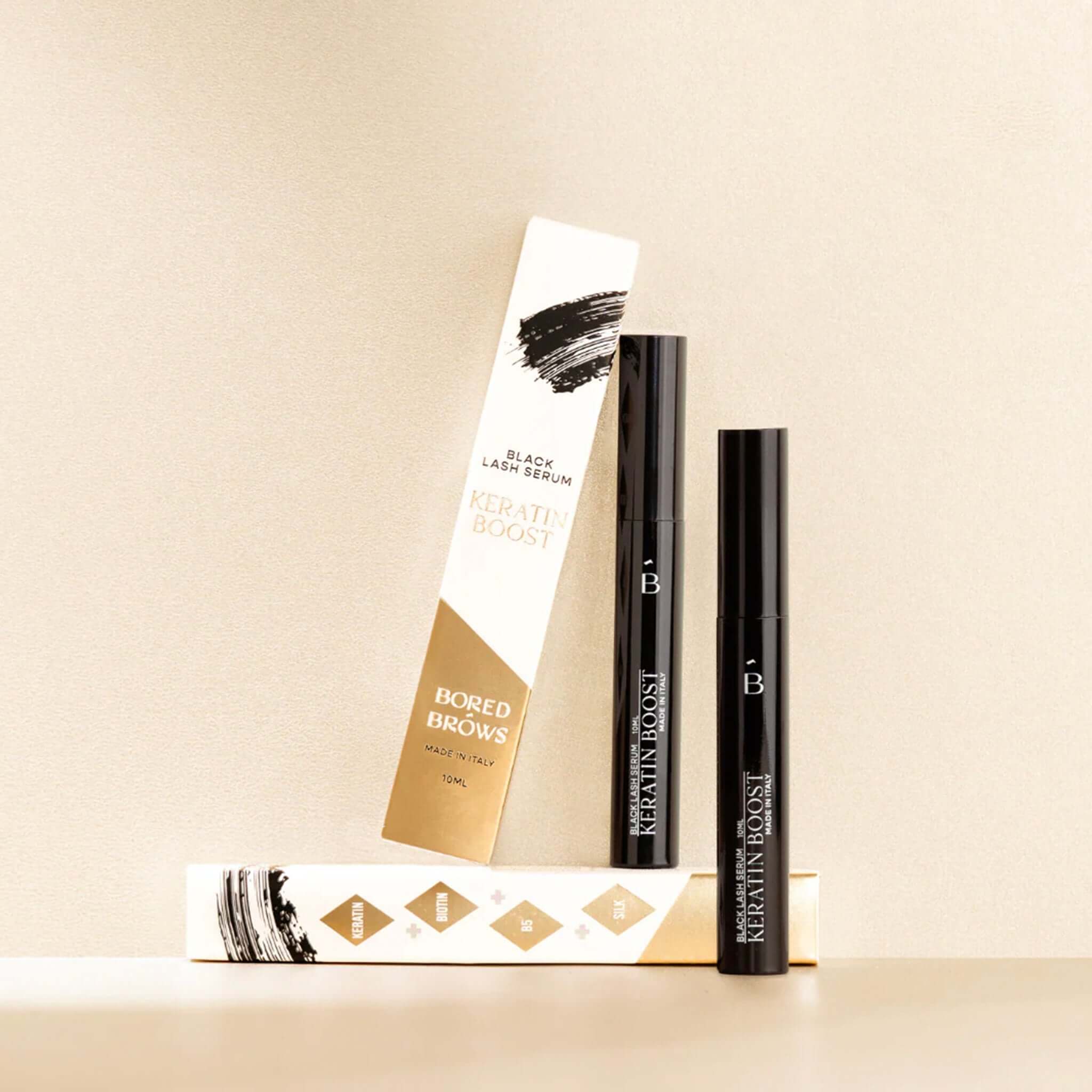 Alt Tag: Bored Brows Black Lash Serum keratin boost black-tinted lash serum packaging for longer, thicker, healthier-looking lashes