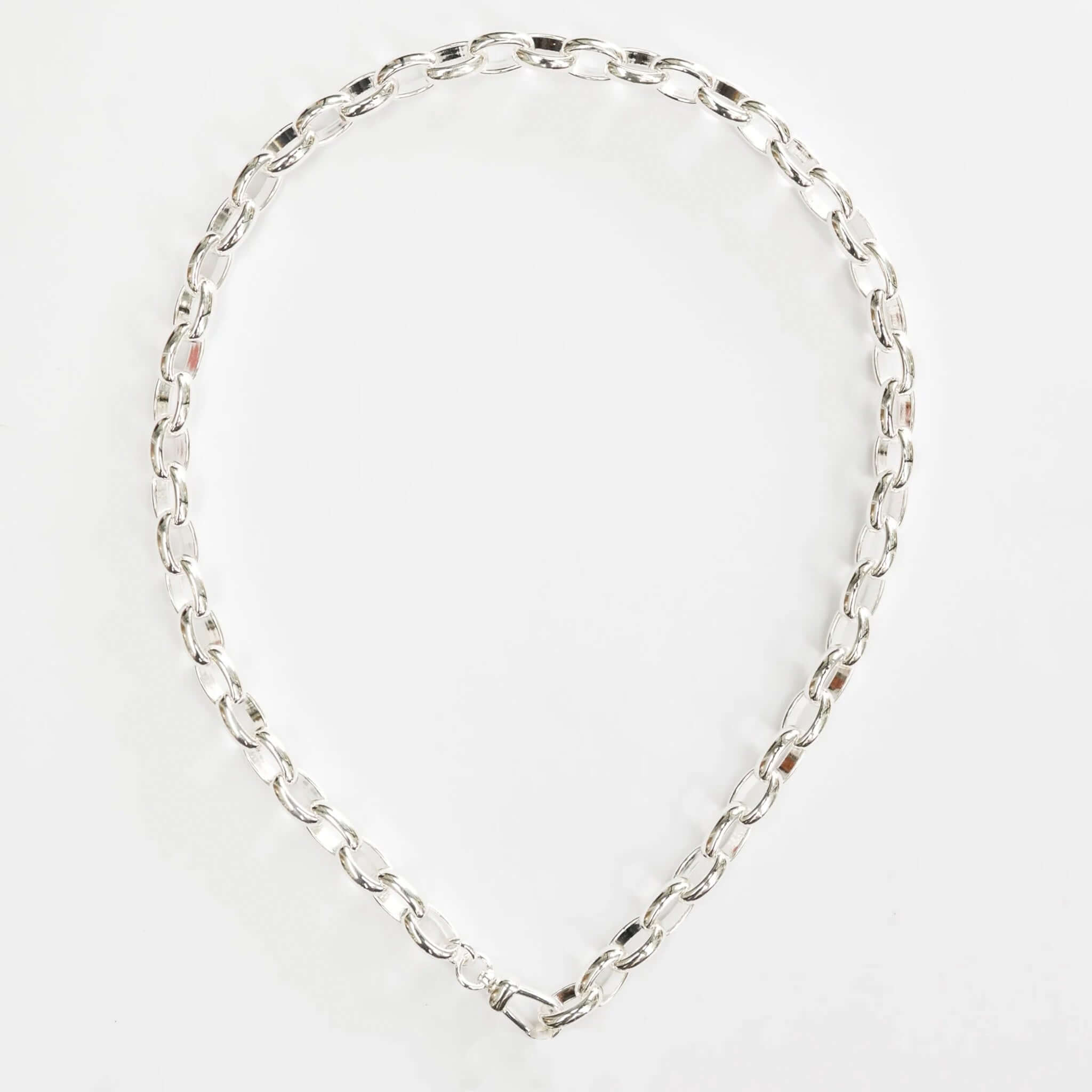 Alt Tag: Cathy Pope Empire Necklace - Silver oversized oval chain necklace with sculptural links, draped statement jewelry