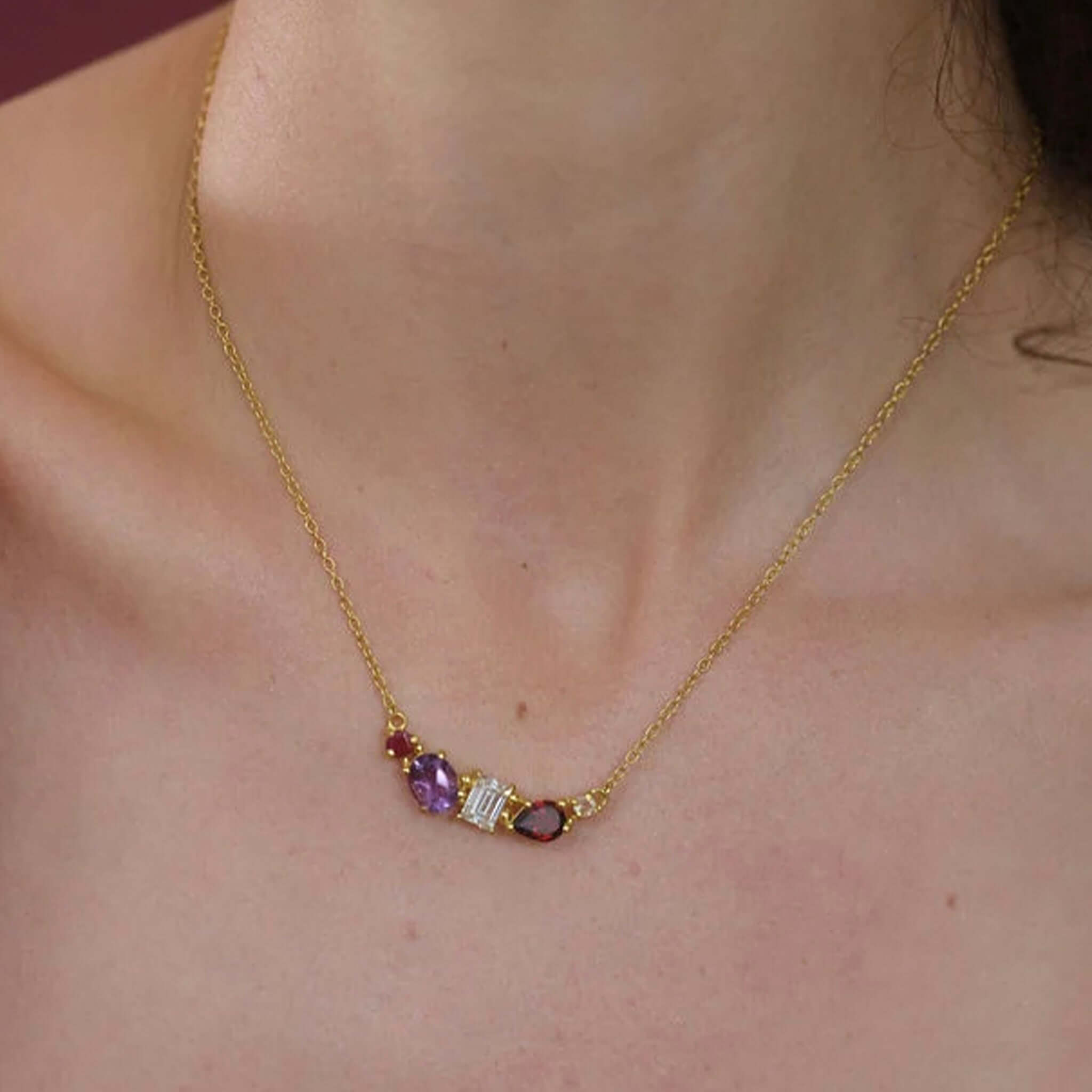 Cathy Pope Elements Collection Gold Necklace - Fire featuring rich amethyst, garnet, and ruby red gemstones.
