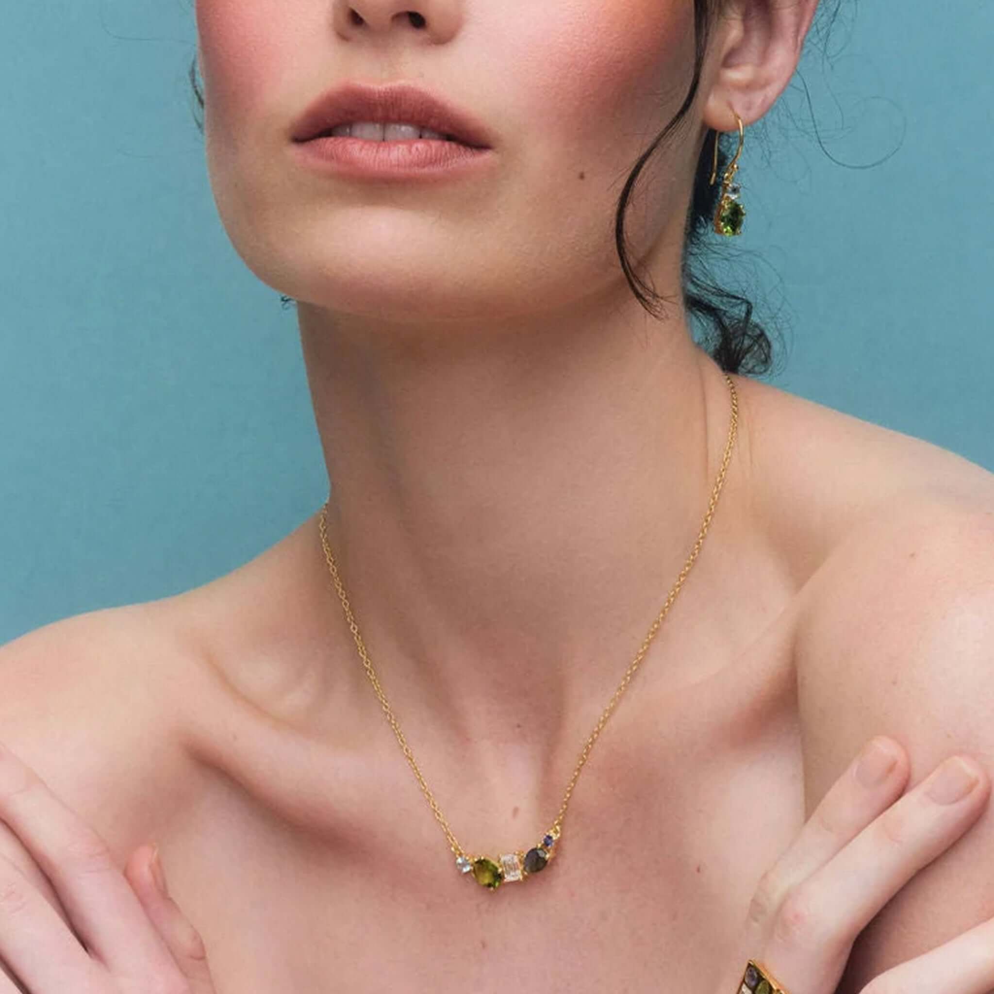 Cathy Pope Elements Collection Gold Necklace - Water worn by model showcasing vibrant gemstones and delicate gold chain.