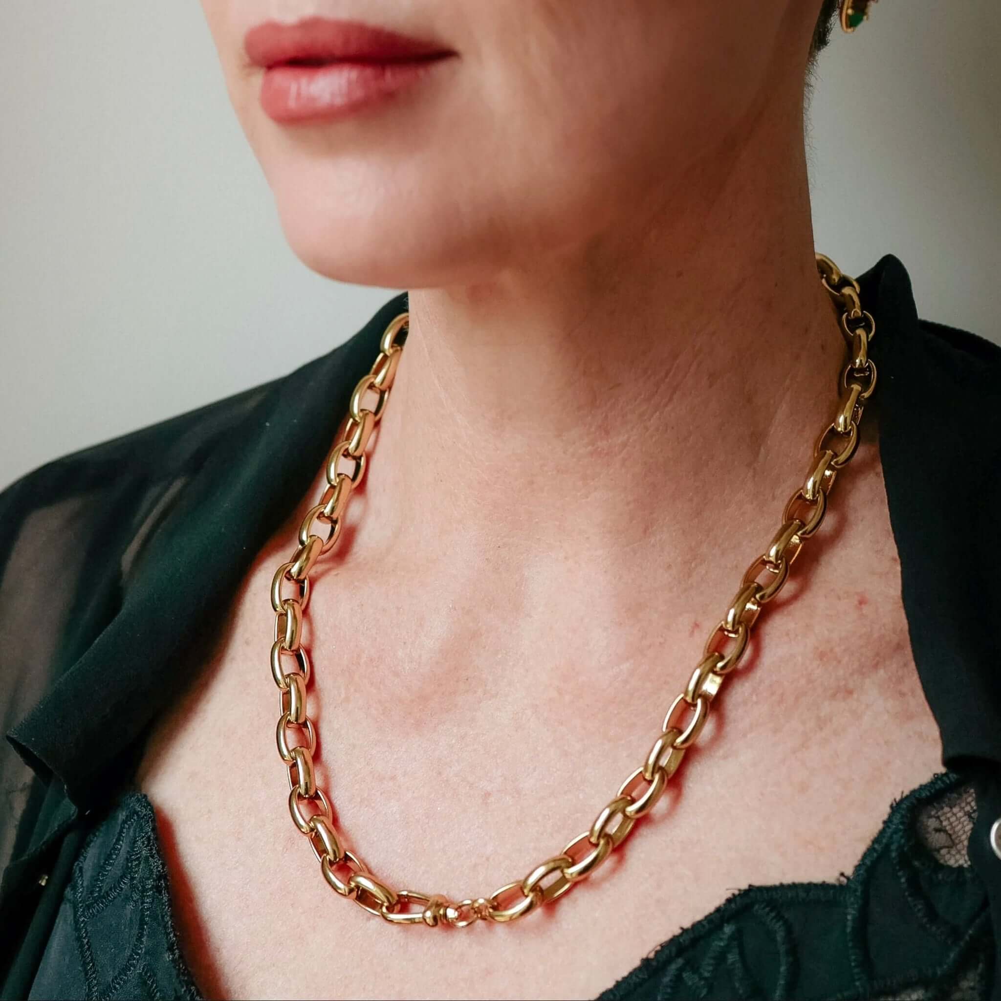 Alt Tag: Cathy Pope Empire Necklace - Gold on model, oversized oval chain necklace in polished gold links, modern statement jewelry