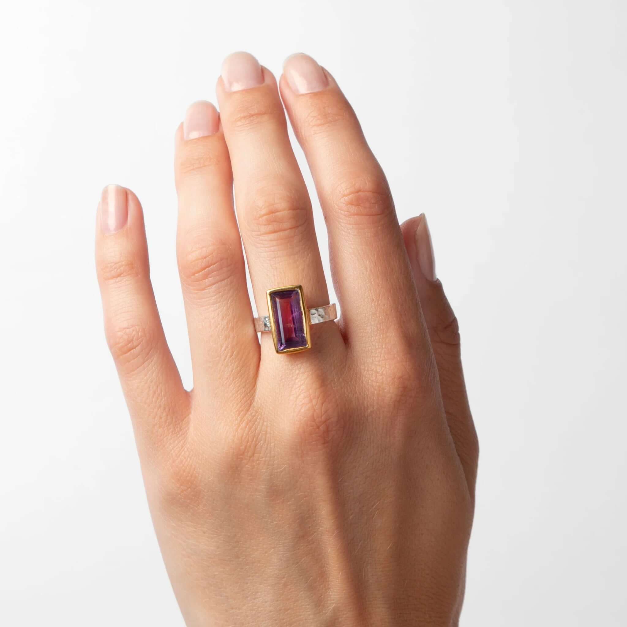 Cathy Pope Oracle Gold & Silver Ring - Amethyst displayed on a hand, featuring a faceted amethyst baguette.