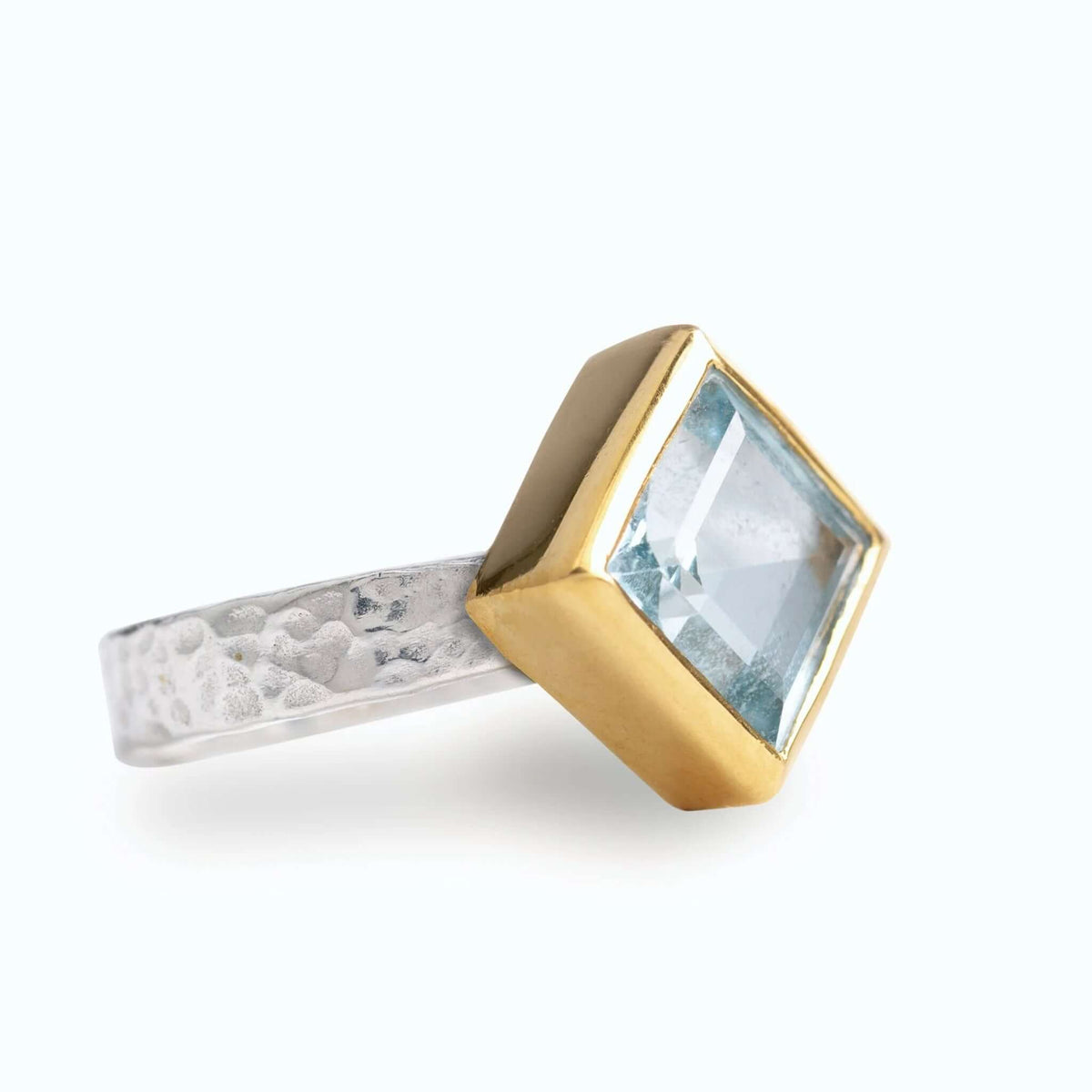 Cathy Pope Oracle Gold & Silver Ring - Blue Topaz featuring a square blue topaz on a hammered silver band.