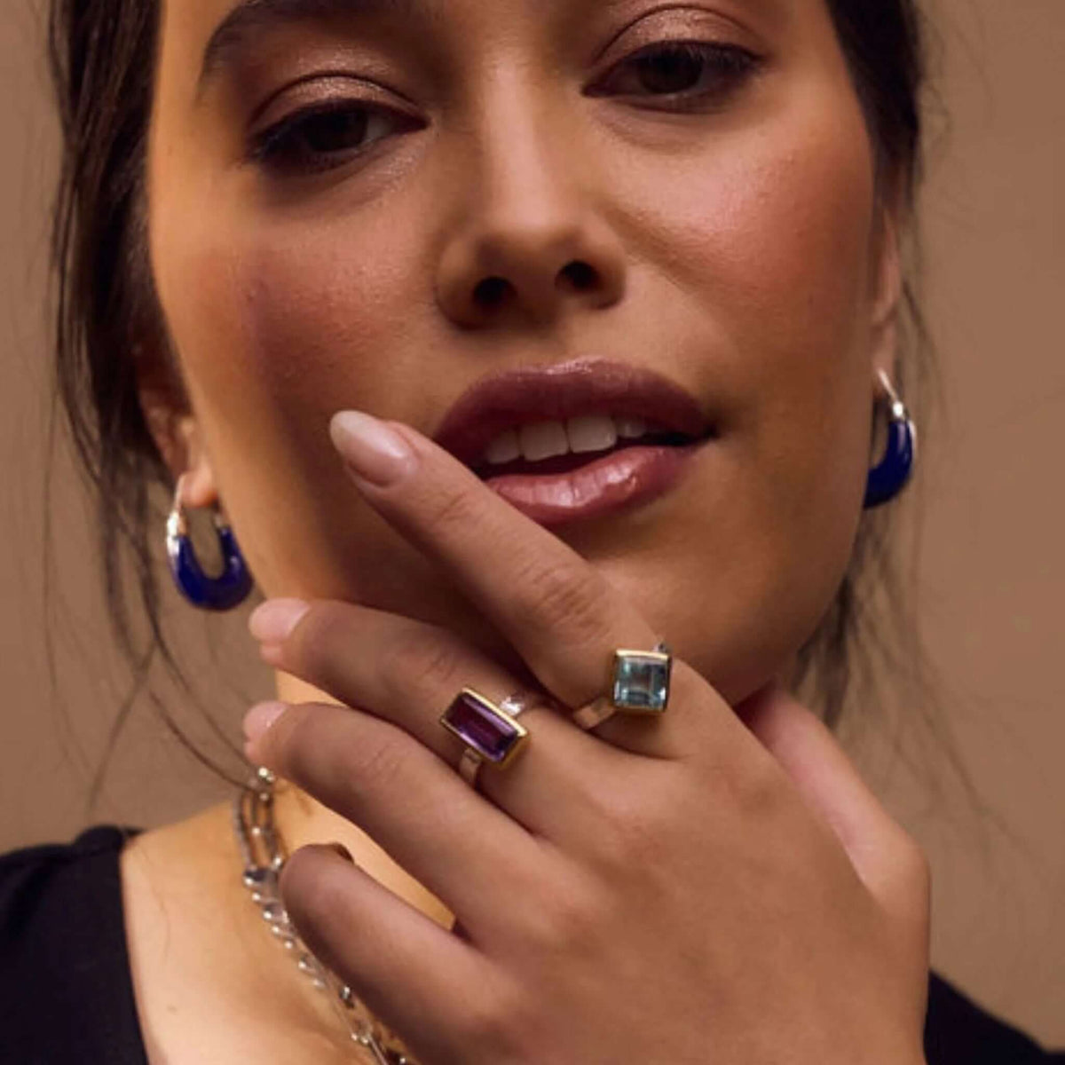 Cathy Pope Oracle Gold & Silver Ring - Blue Topaz worn by a model, showcasing the striking blue topaz set on a silver band.