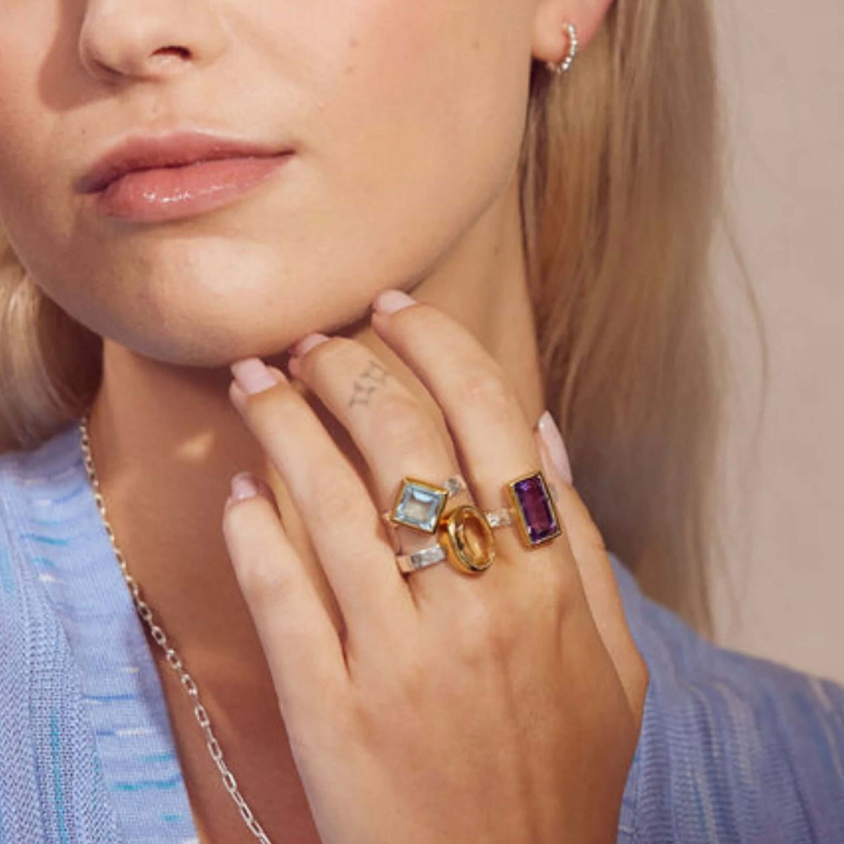Cathy Pope Oracle Gold & Silver Ring - Citrine showcased on a model's hand featuring multiple statement rings.