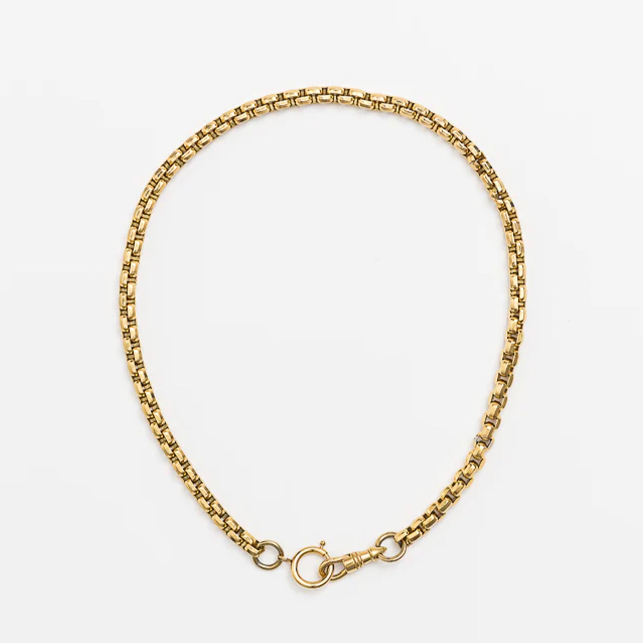 Gold chain necklace on a white background