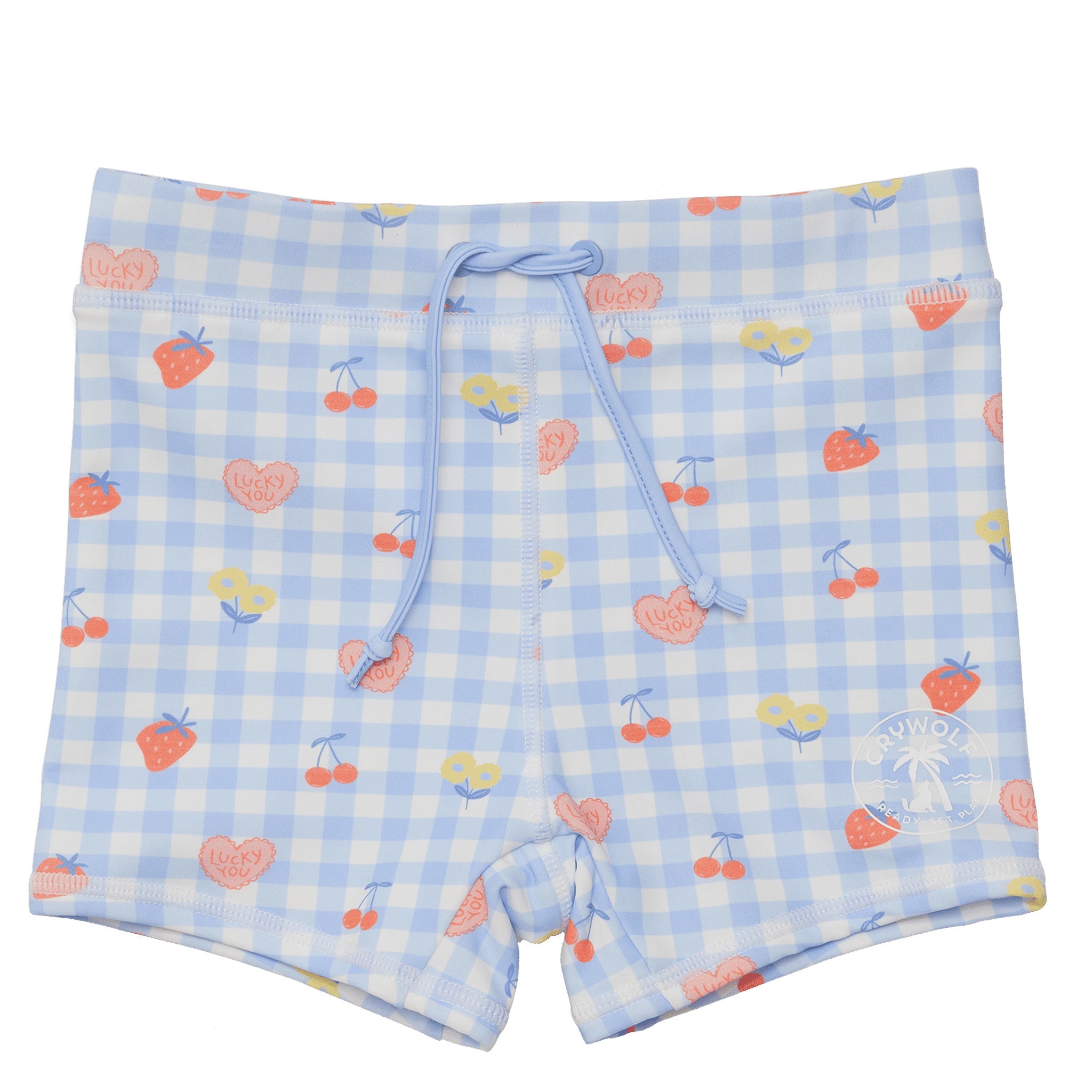Toddler wearing patterned baby swim shorts on white background