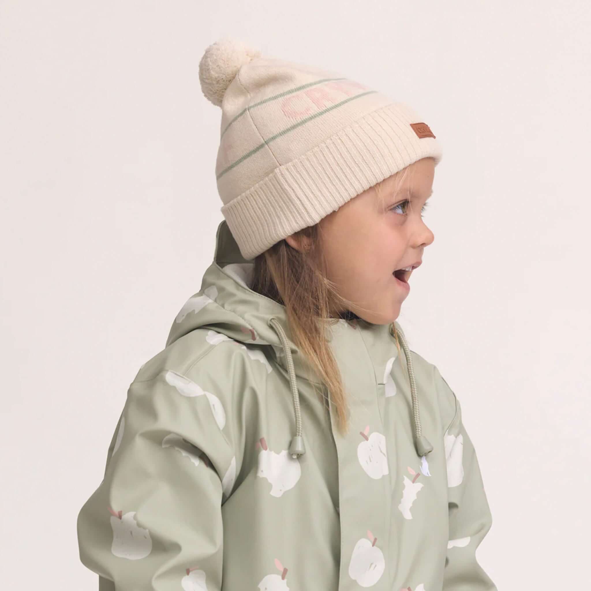 Alt Tag: Crywolf Alpine Beanie - Harvest on child model, retro ski style pom-pom beanie in super-soft Polylana recyclable fibre