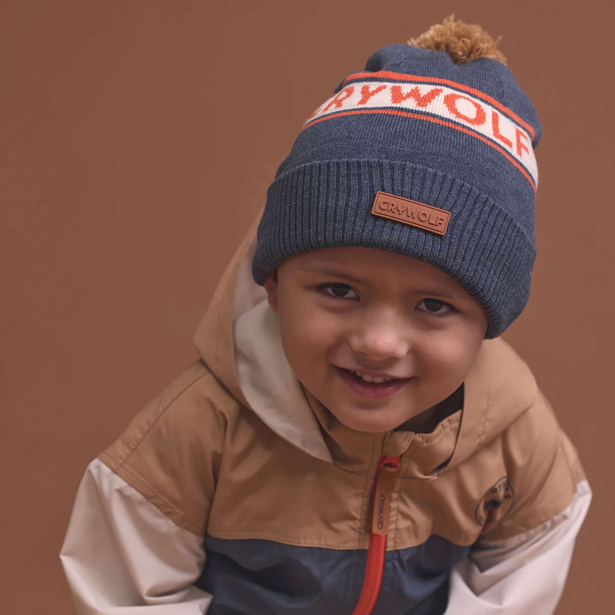 Alt Tag: Crywolf Alpine Beanie -  Indigo kids retro ski beanie with pom pom, warm soft Polylana recyclable fibre winter hat