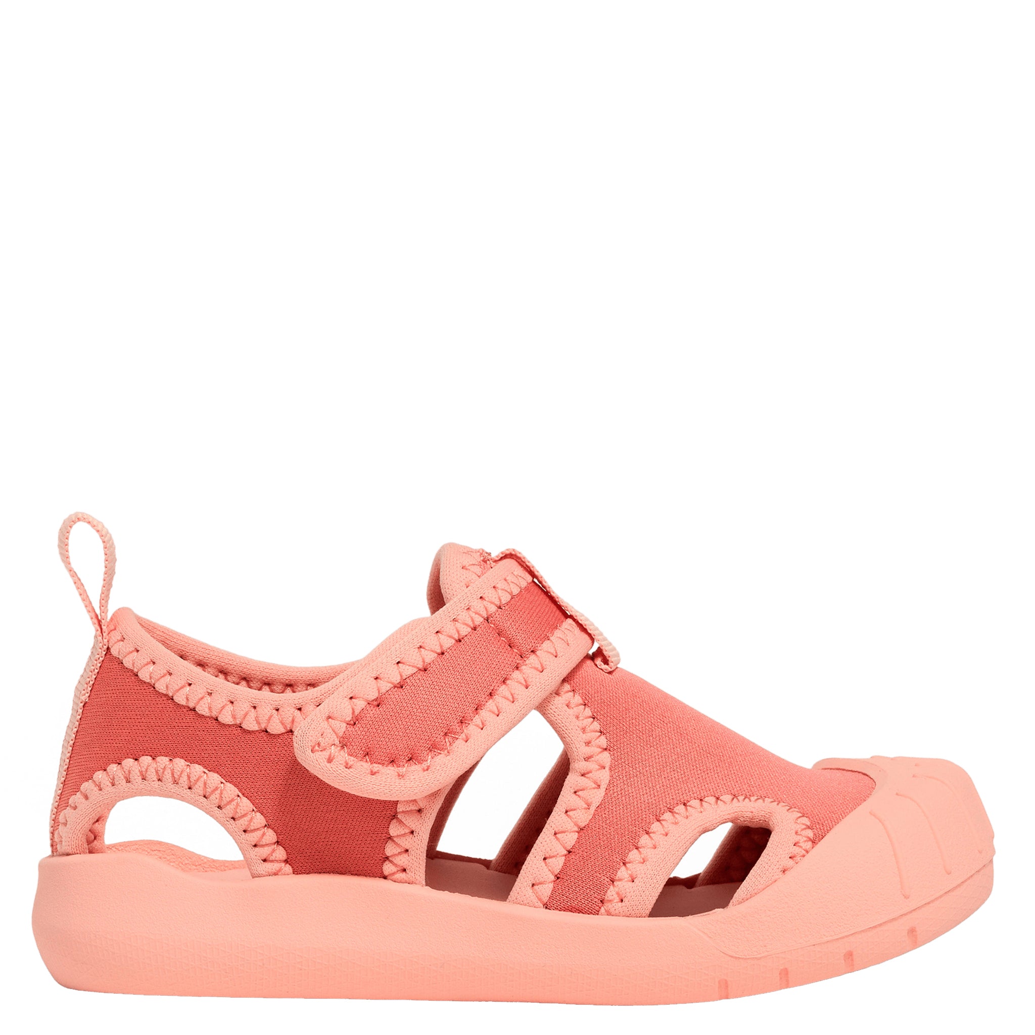 Pink sandal with a strap on a white background