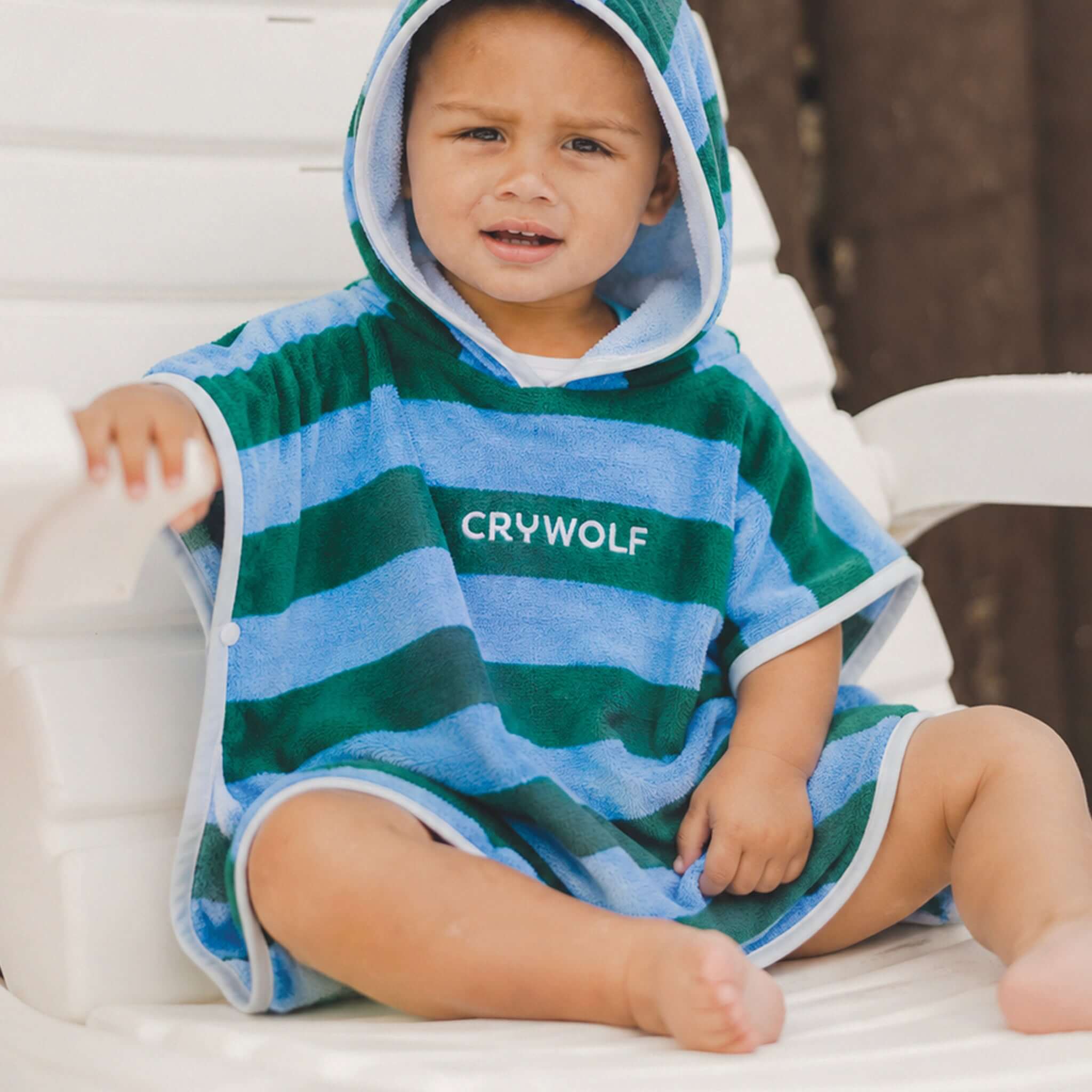 Crywolf Baby Hooded Towel - Deck Stripe on a child after bath time, showcasing its soft cotton and cozy hood.
