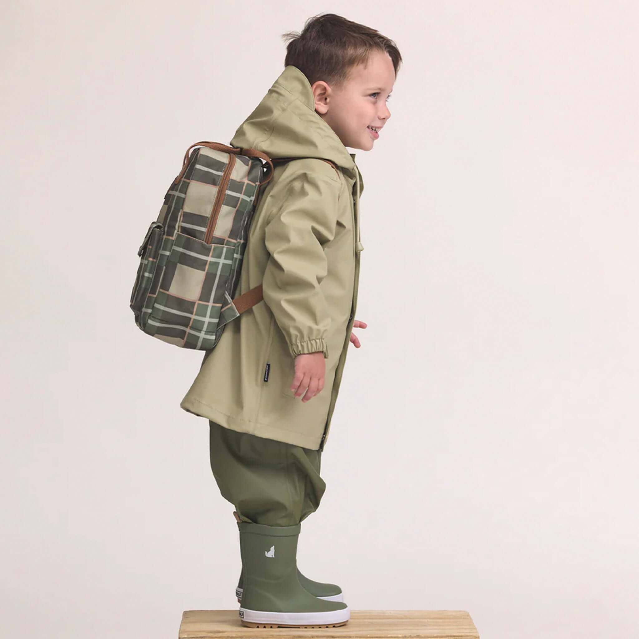Alt Tag: Crywolf Mini Backpack - Field Plaid on child model, 9L lightweight water-resistant recycled mini backpack for kindy and adventures