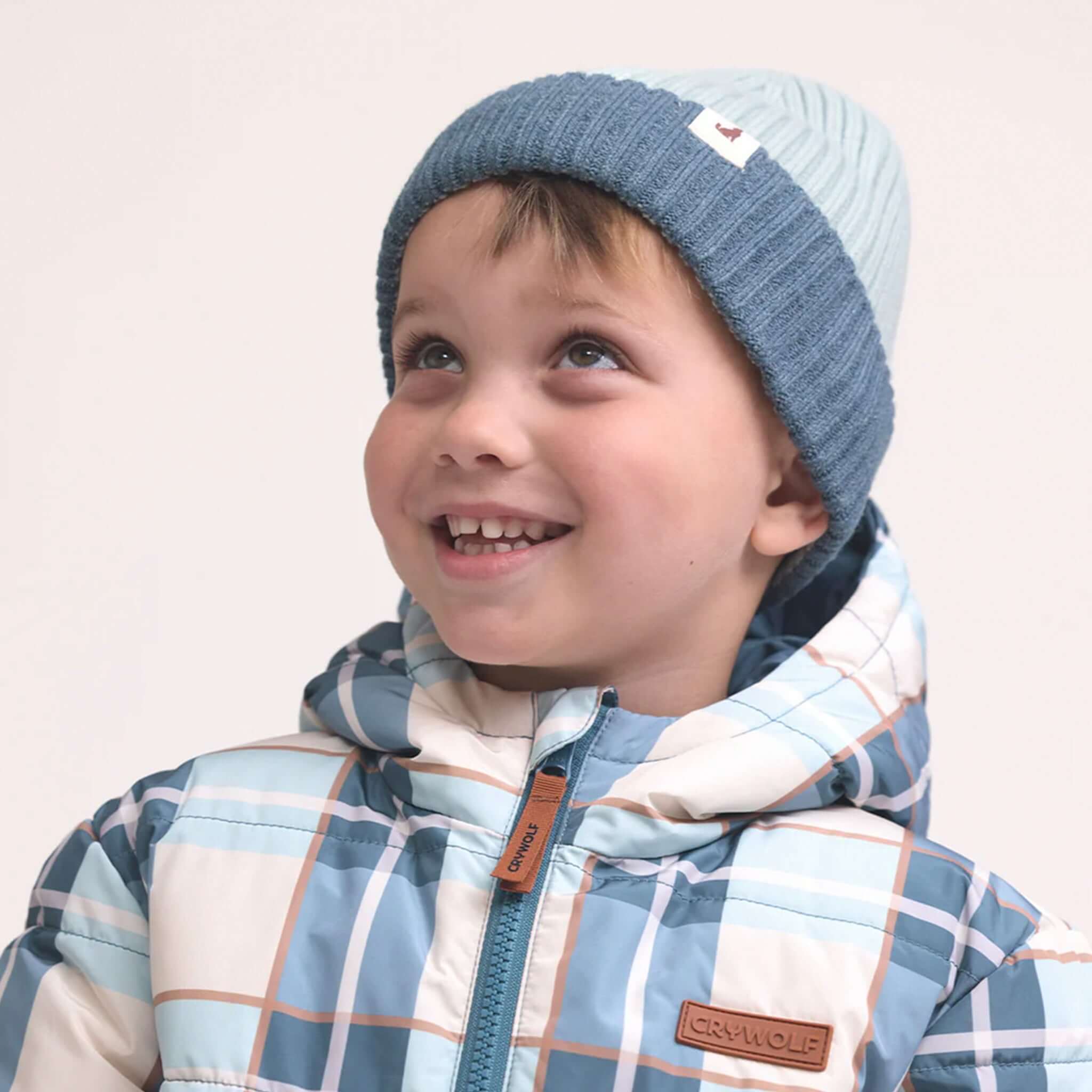 Alt Tag: Crywolf Tasman Beanie - Blue colourblock ribbed knit kids beanie, slimline no-pom fit under helmets, soft Polylana® warmth