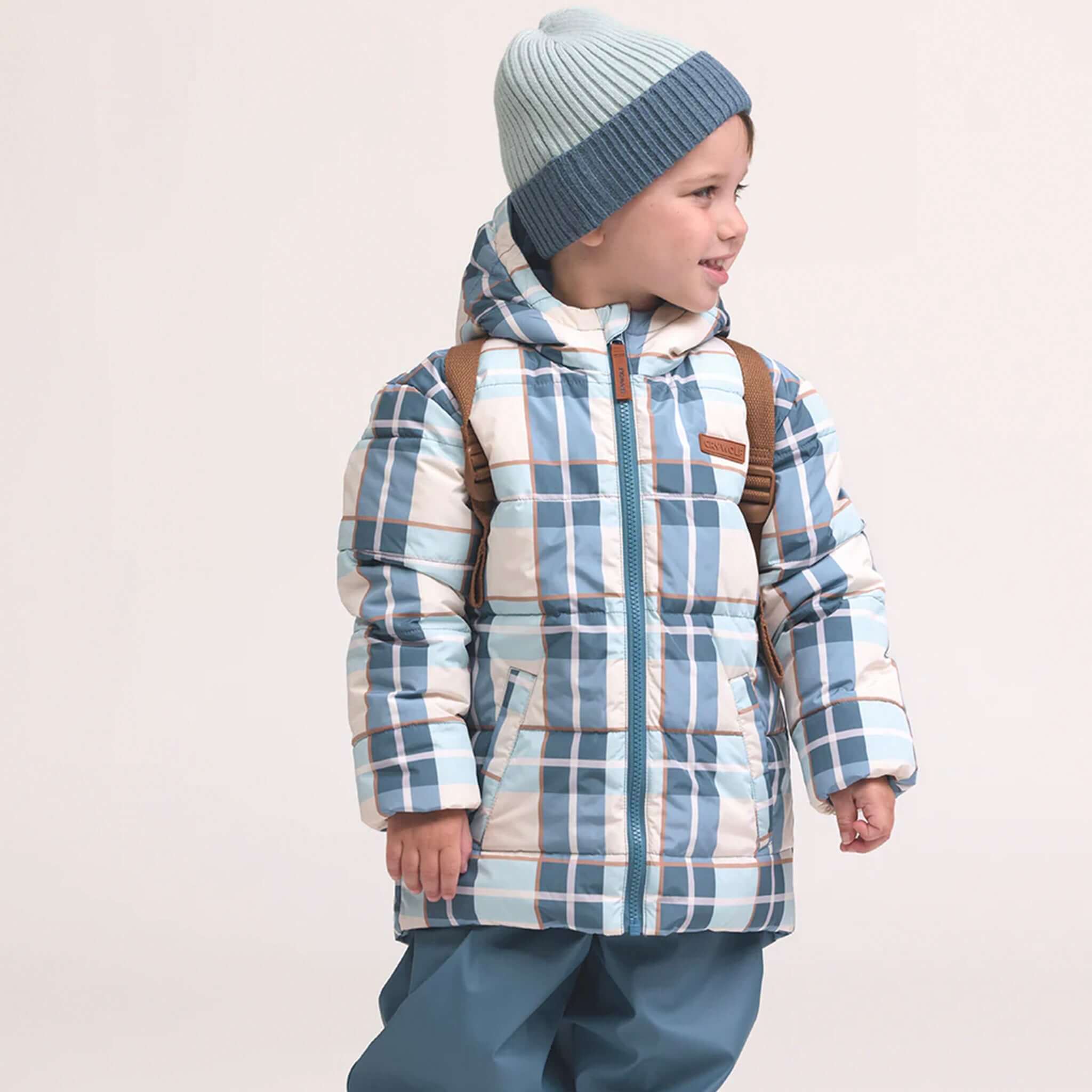 Alt Tag: Crywolf Tasman Beanie - Blue on kid, slimline ribbed knit Polylana® beanie under hood, cosy lightweight winter warmth