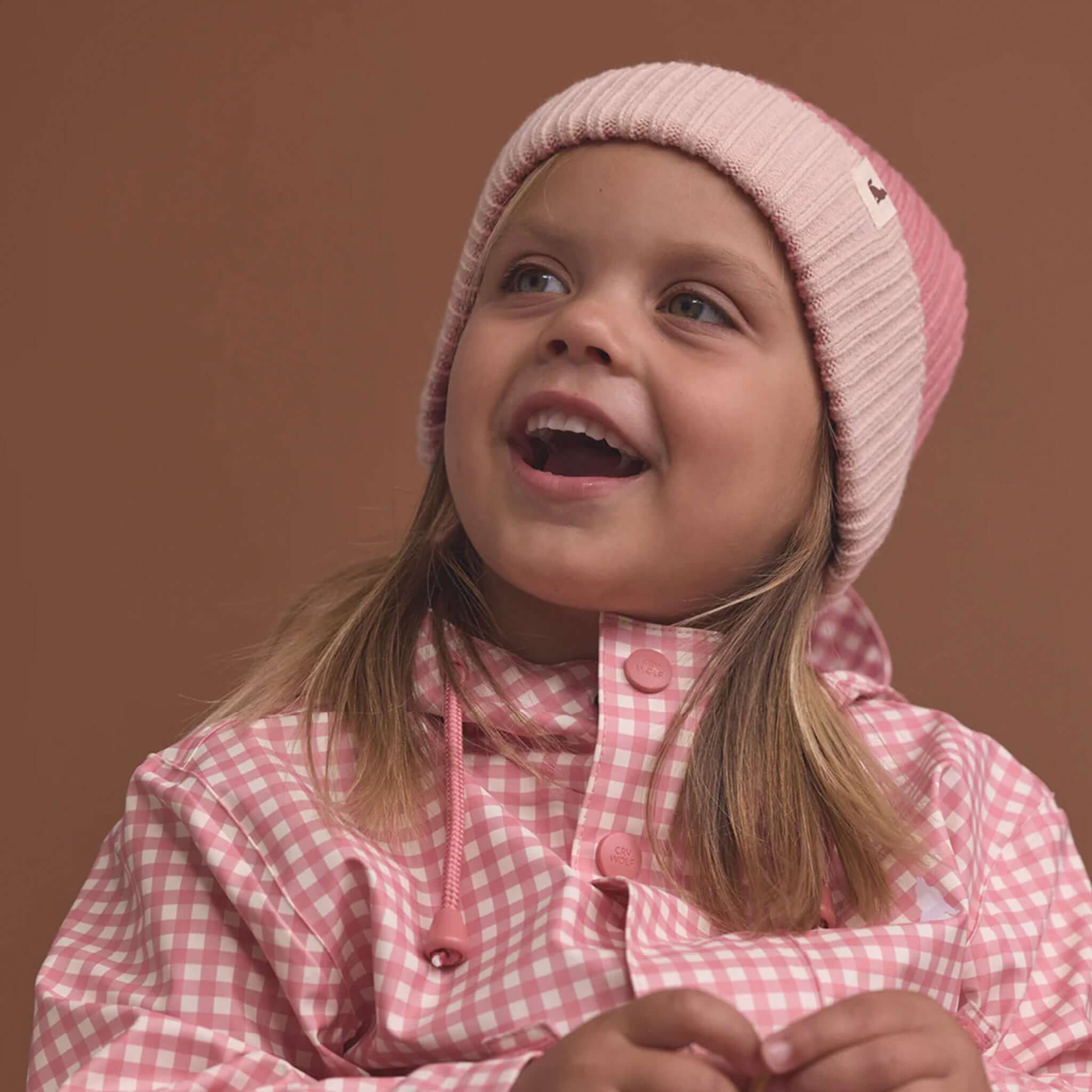 Alt Tag: Crywolf Tasman Beanie - Rose on child, slimline ribbed knit rose beanie with colourblock style, cosy lightweight warmth