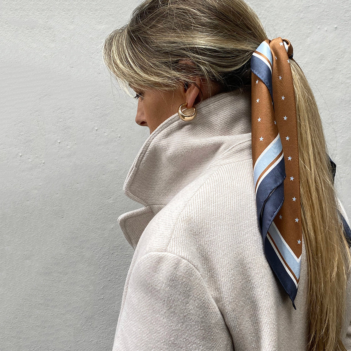 Dark Hampton Petite Silk Scarf - the Borey tied in a ponytail, side view on model
