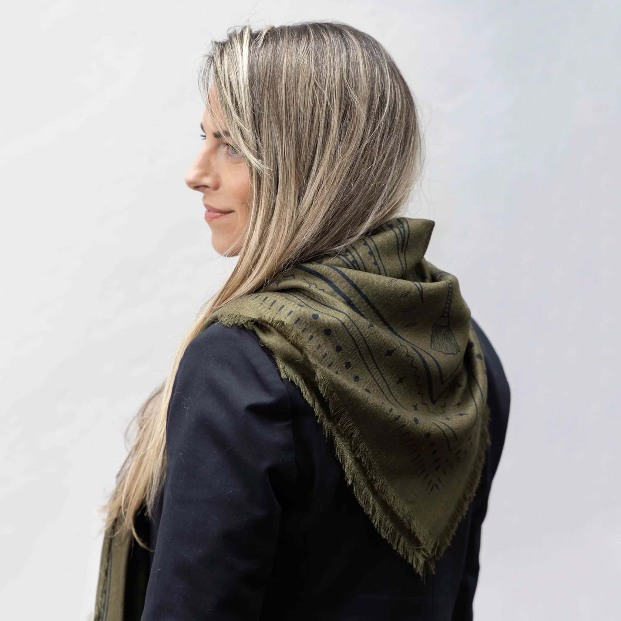 Dark Hampton x Ellie Compton the Yorke Wool Silk Scarf draped stylishly in olive and black colorway.