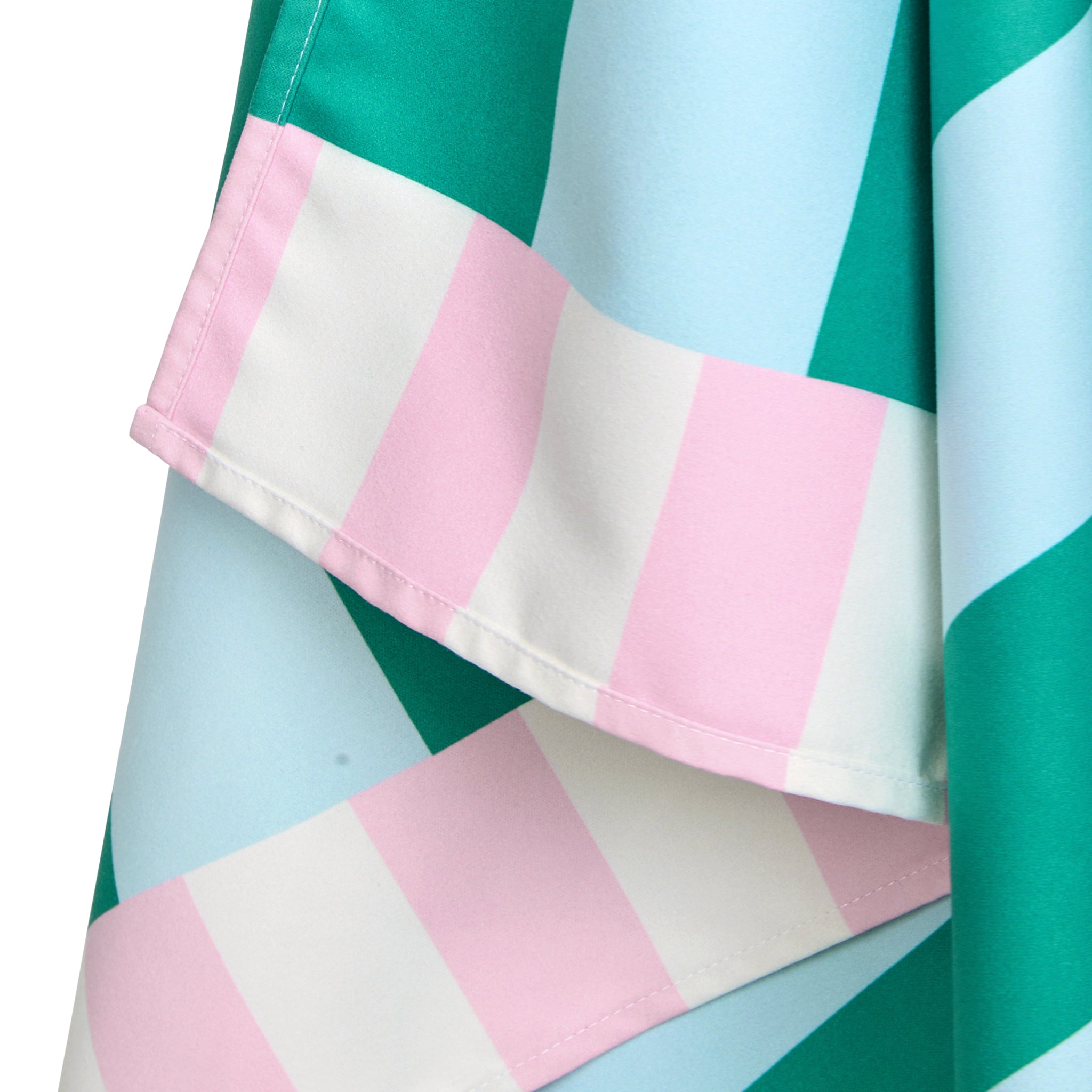 Close-up of a fabric with pink, white, and green striped pattern