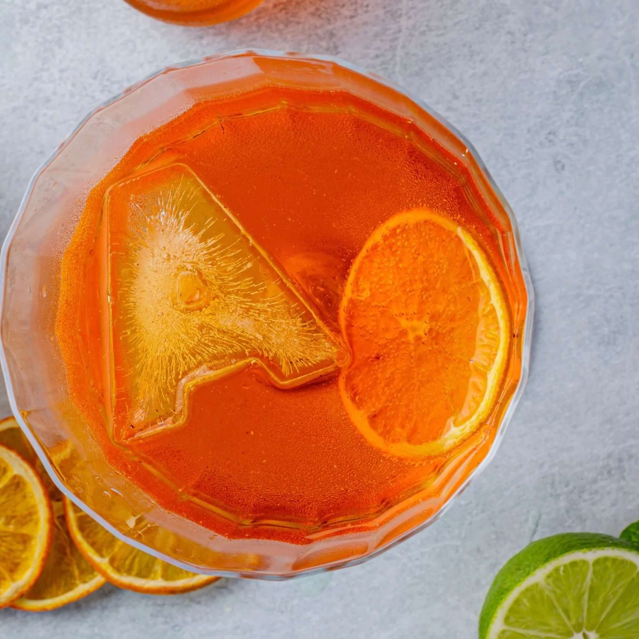 Alt Tag: Drinks Plinks Silicone Ice / Baking Tray - A for Aperol Lovers ice letter A in Aperol spritz cocktail with orange slice