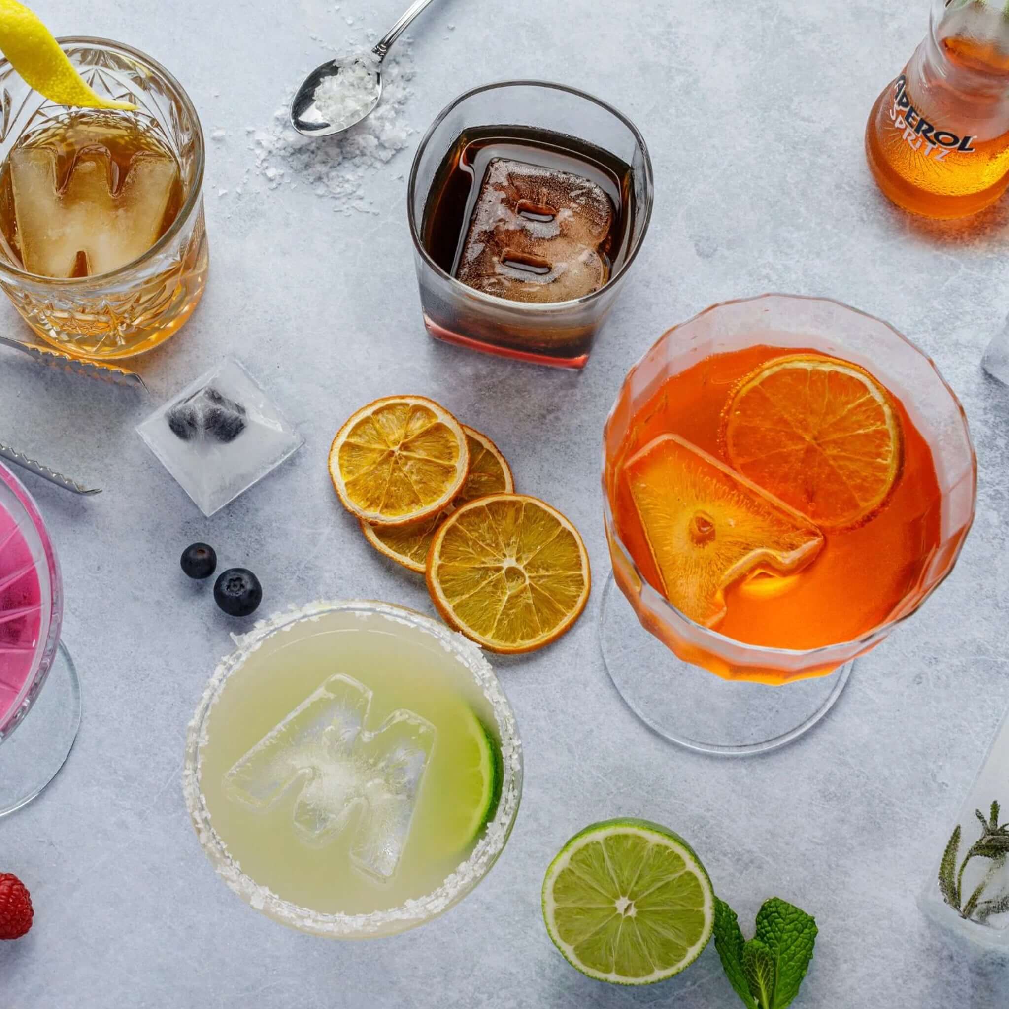 Alt Tag: Drinks Plinks Silicone Ice / Baking Tray - A for Aperol Lovers letter ice cubes in cocktails with citrus slices, dishwasher-safe food-grade silicone