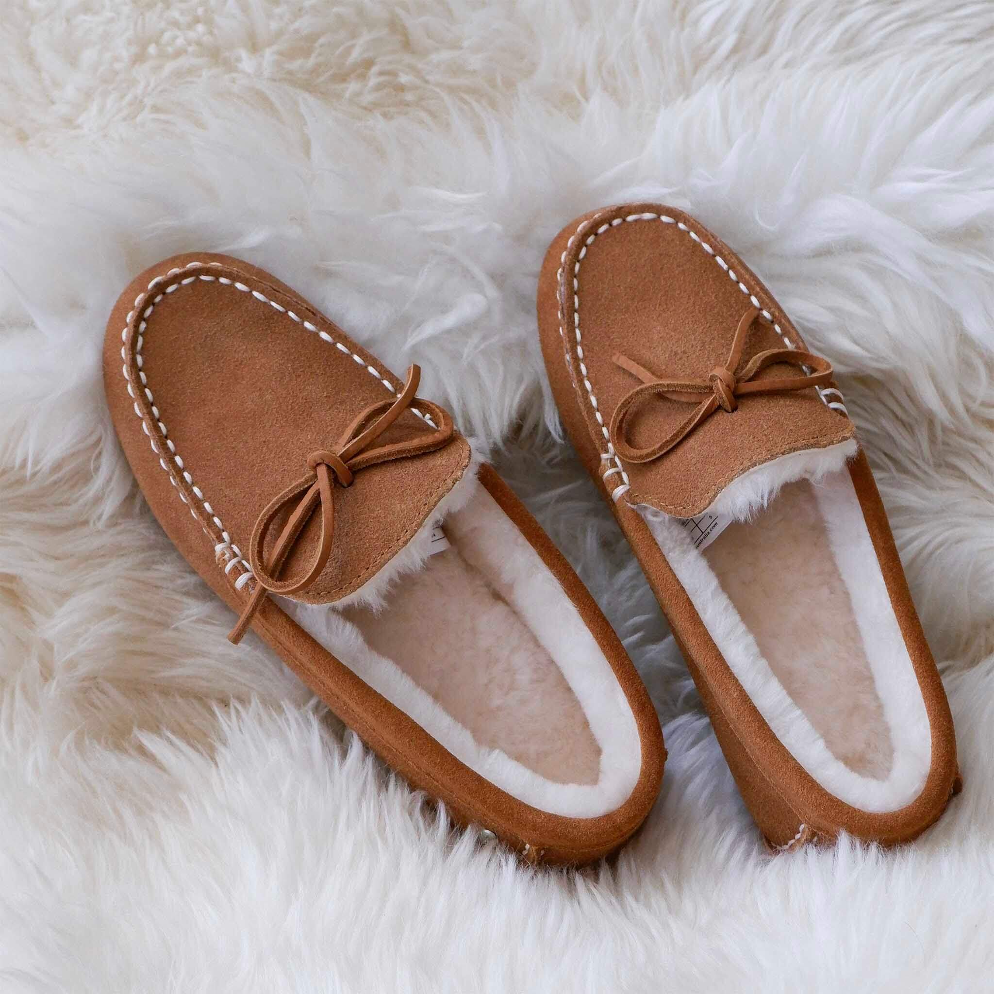EMU Sandrine Slippers - Camel on a fluffy surface, featuring soft suede, sheepskin lining and vintage leather lace detail.
