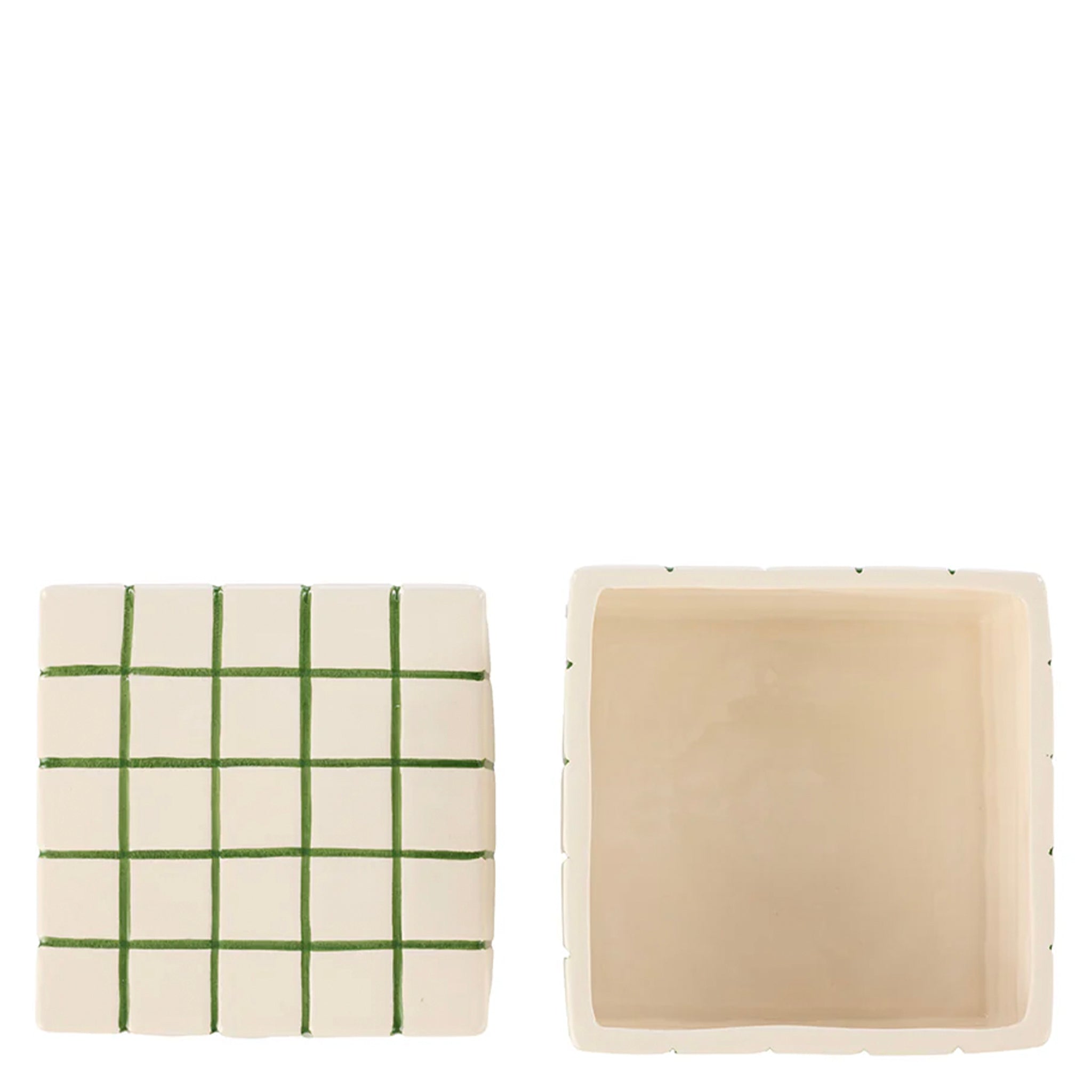 Two square cushions, one with green grid pattern and the other plain beige, on a white background.
