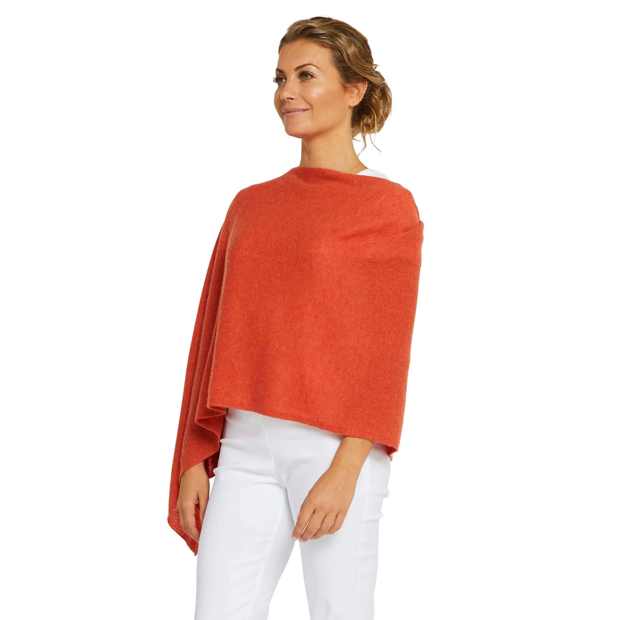 Esperance & Co Classic Cashmere Topper - Autumn worn casually by a woman in a vibrant orange hue.