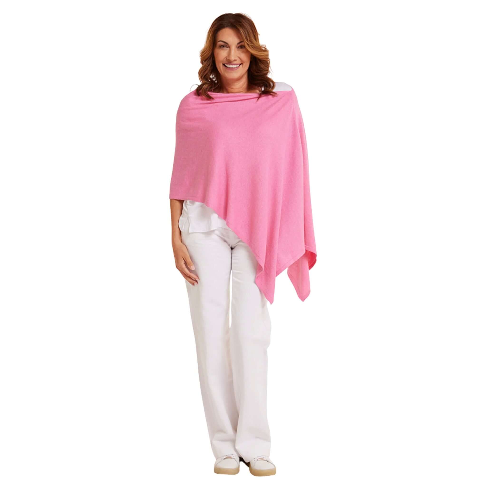 Esperance & Co Classic Cashmere Topper - Glam Pink worn stylishly with white pants.