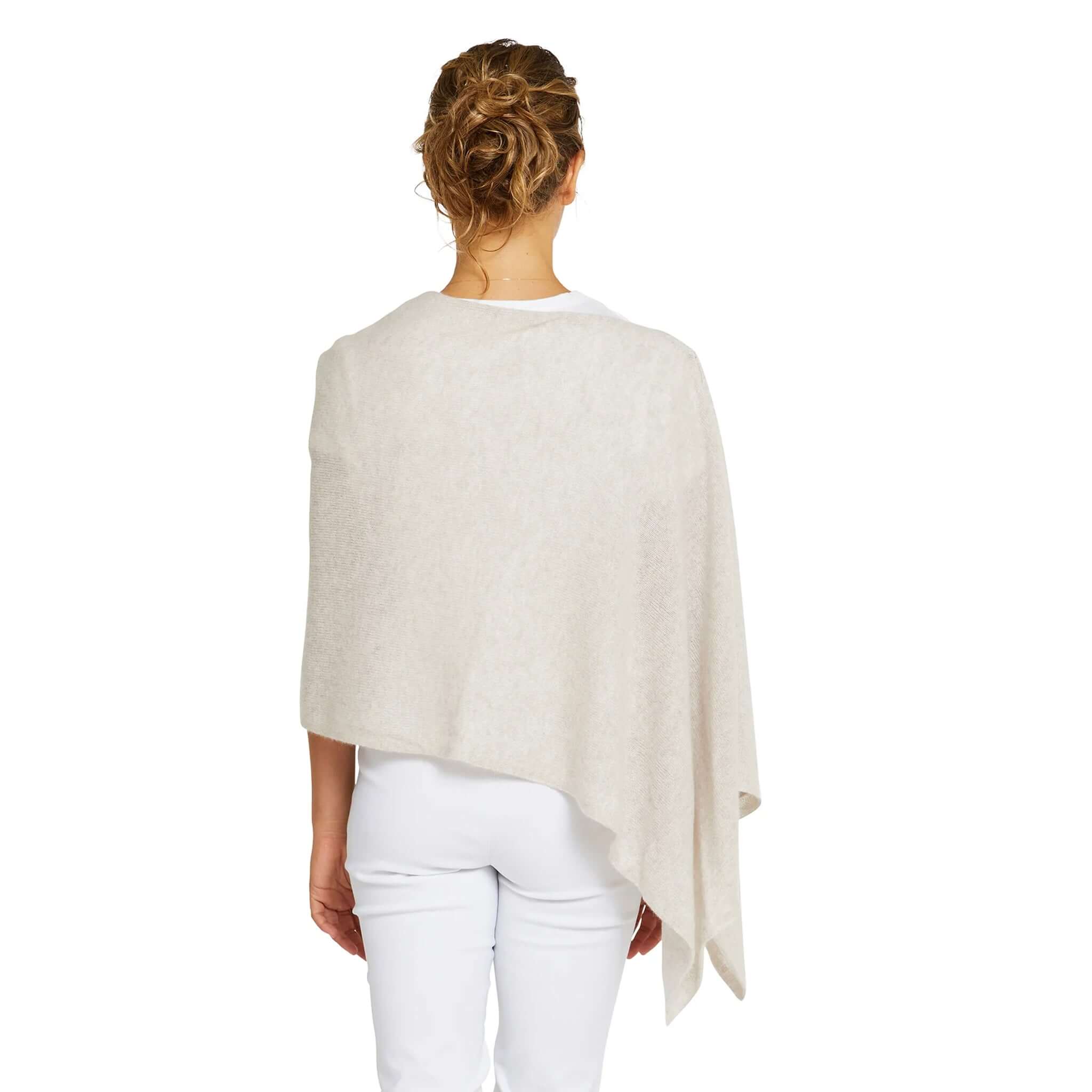 Alt Tag: Esperance & Co Classic Cashmere Topper - Latte worn as a soft draped wrap, back view, luxe cashmere travel layering piece