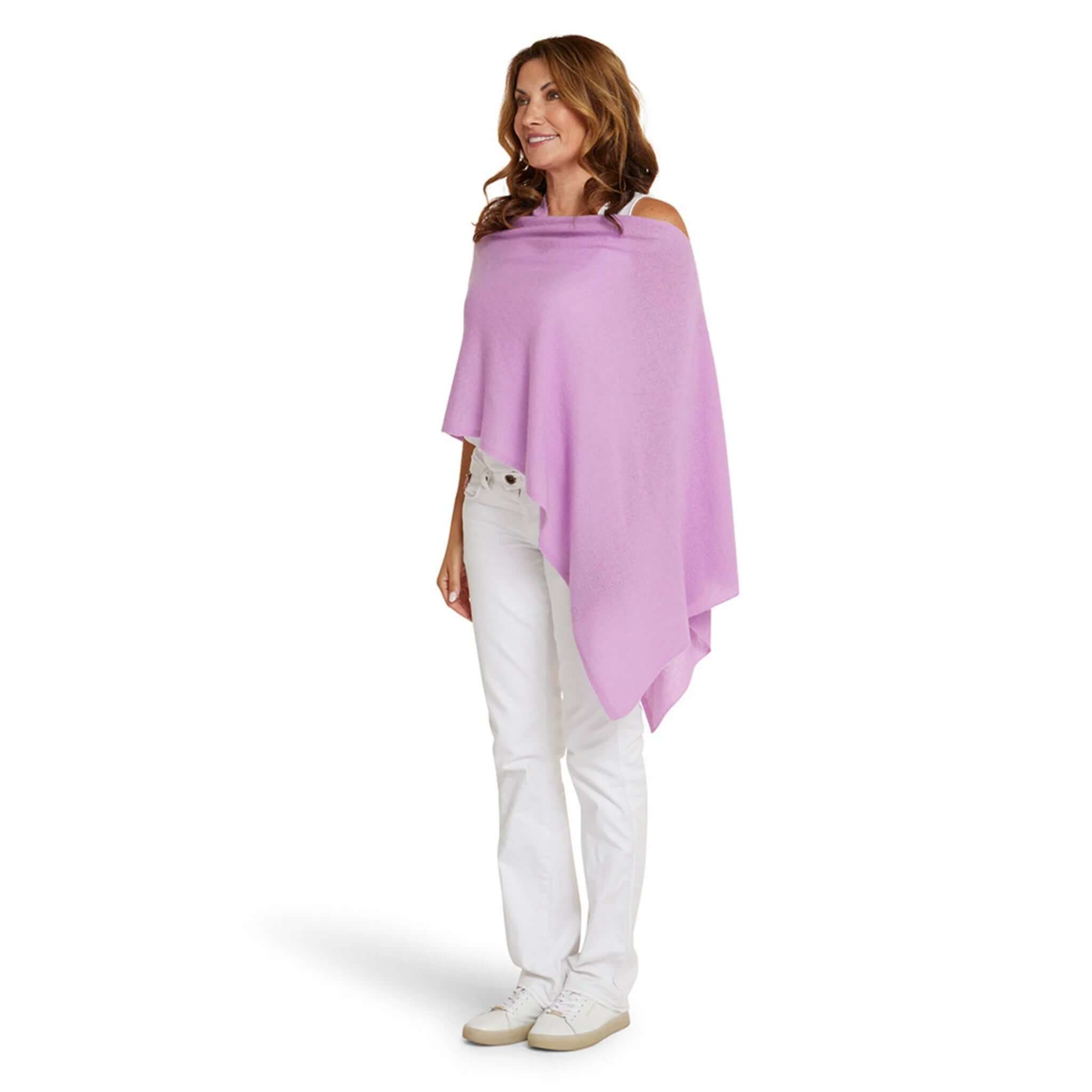 Alt Tag: Esperance & Co Classic Cashmere Topper - Riviera worn as a draped poncho wrap in soft lilac, versatile luxury travel layering piece