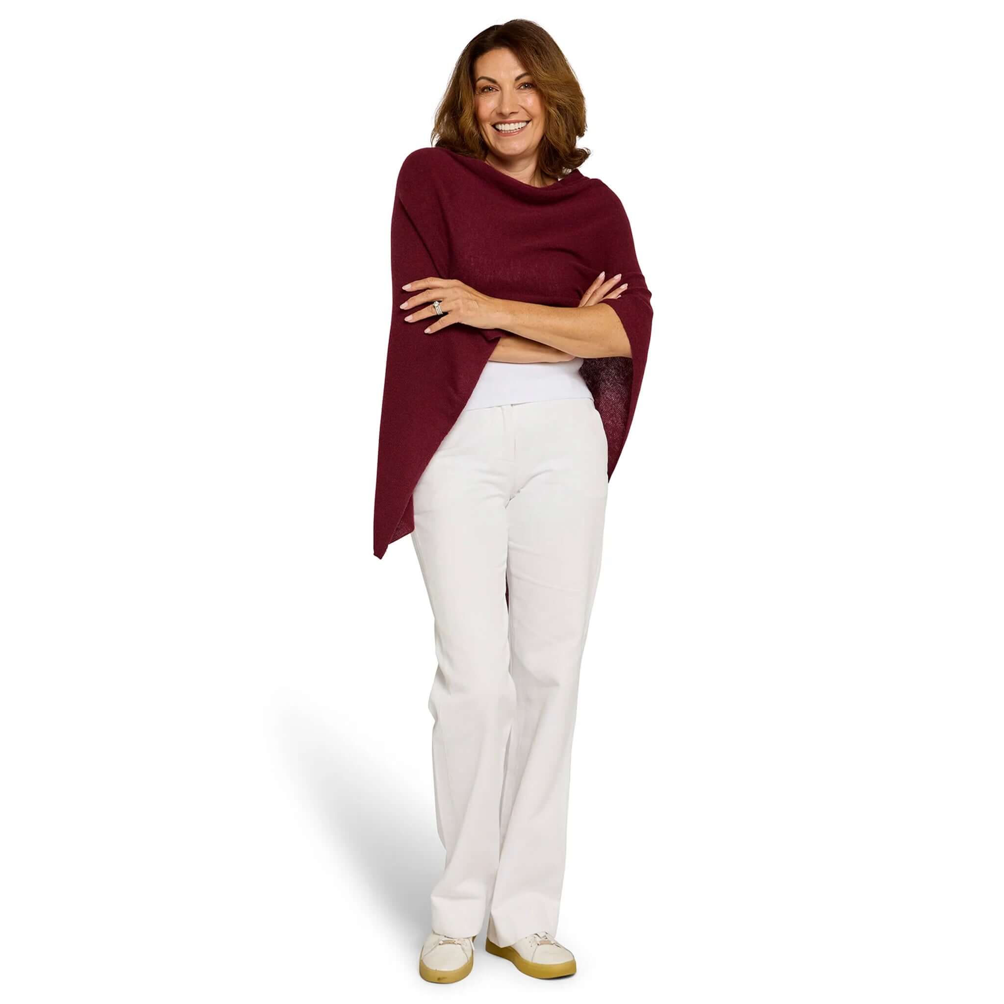 Esperance & Co Classic Cashmere Topper - Sangria worn by a woman, styled casually with white pants.