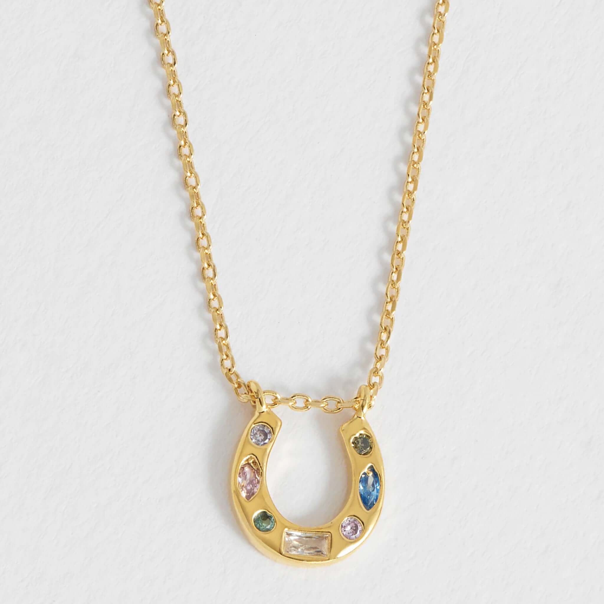 Alt Tag: Estella Bartlett Horse Shoe Multi Pastel CZ Necklace - Gold Plated gold horseshoe pendant necklace with pastel cubic zirconia stones