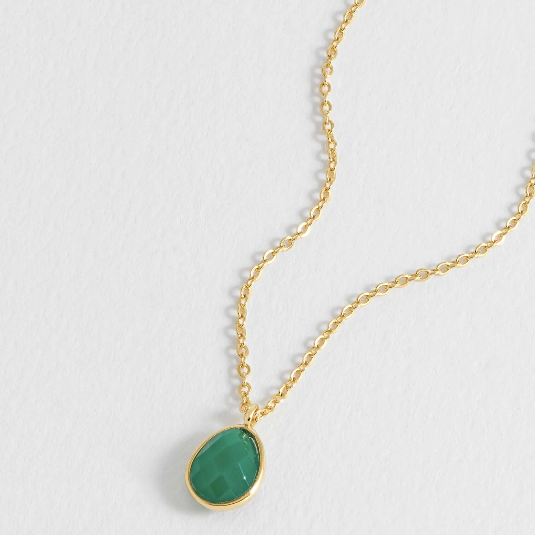 Estella Bartlett Wellness Faceted Teardrop Necklace - Green Agate with a gold-plated dainty chain and green agate pendant.