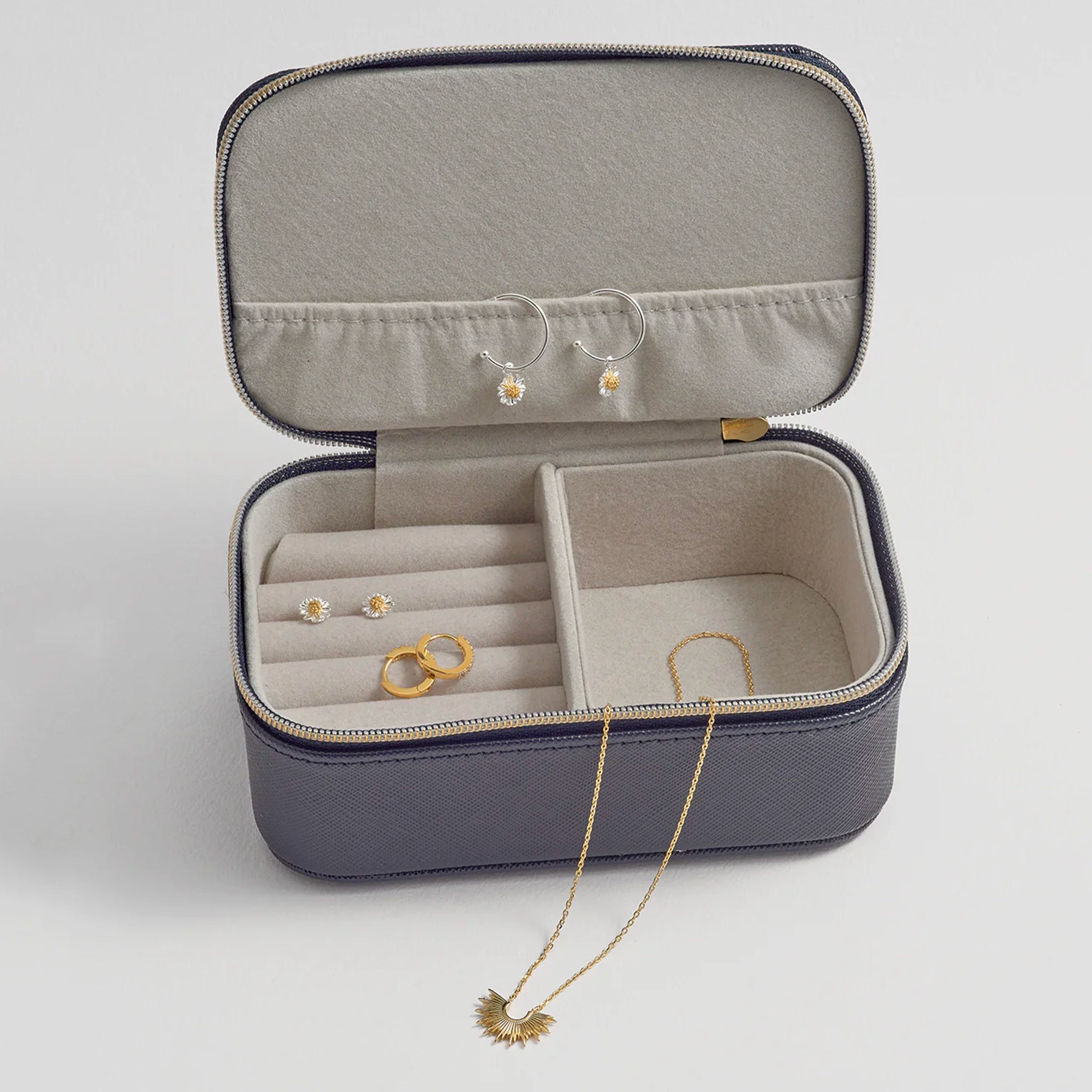 Navy jewelry box with jewelry inside