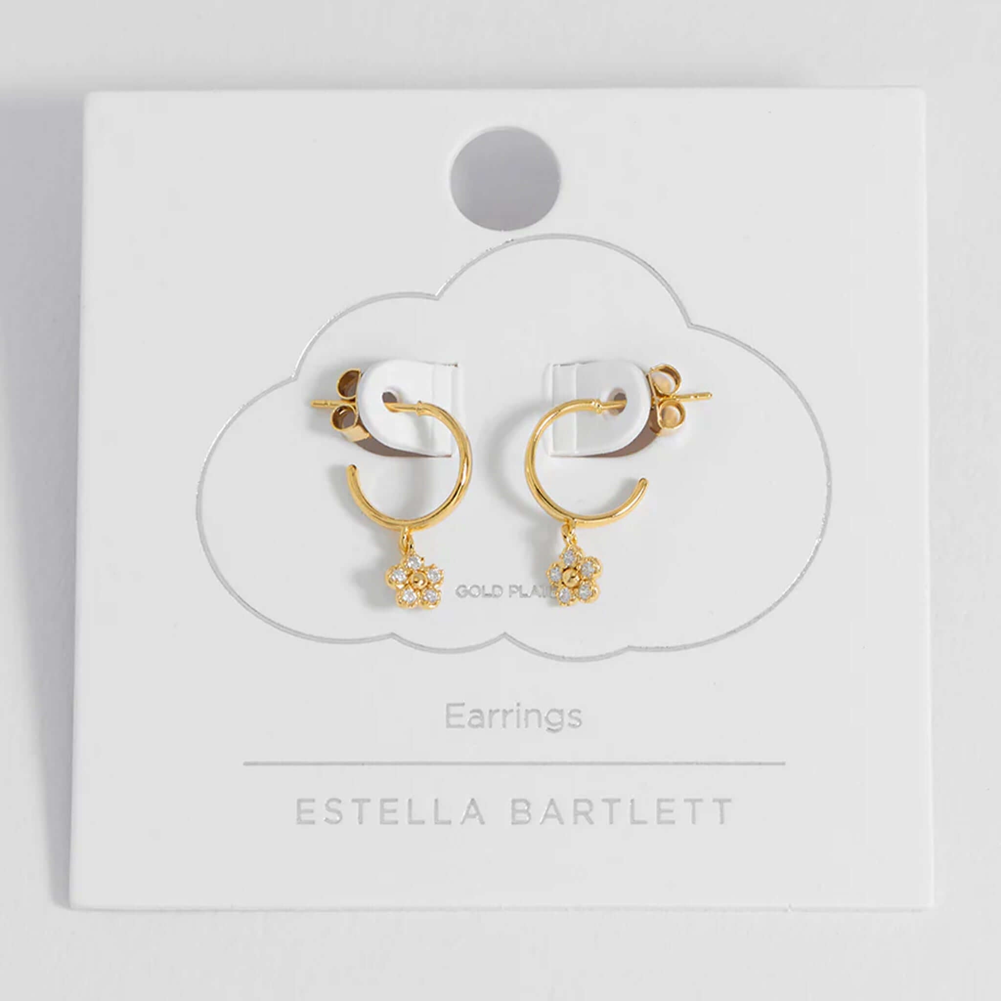 Alt Tag: Estella Bartlett Flower Hoop CZ Earrings - Gold Plated, delicate gold hoop earrings with CZ daisy charm on display card