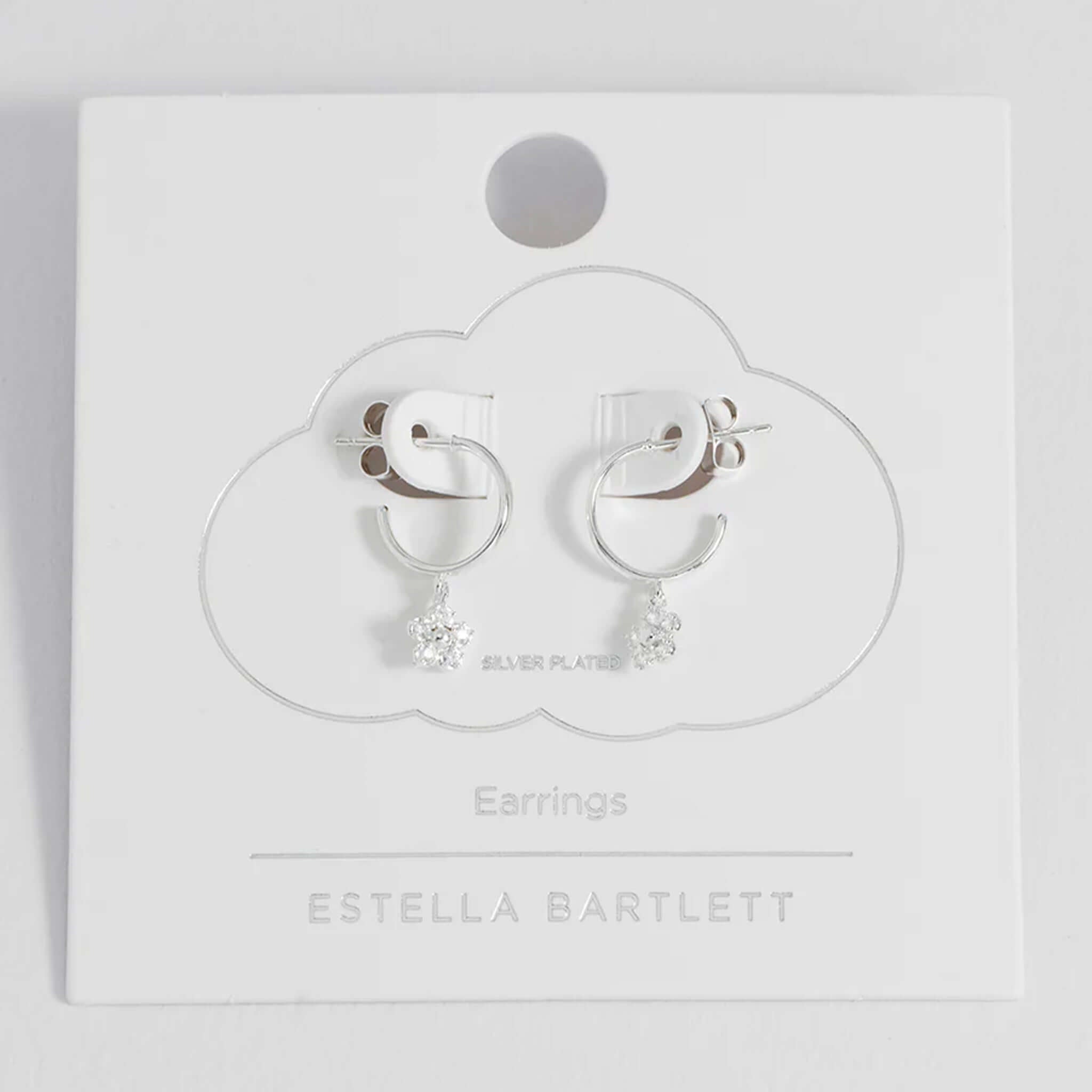 Alt Tag: Estella Bartlett Flower Hoop CZ Earrings - Silver silver-plated hoop earrings with cubic zirconia daisy charm on card