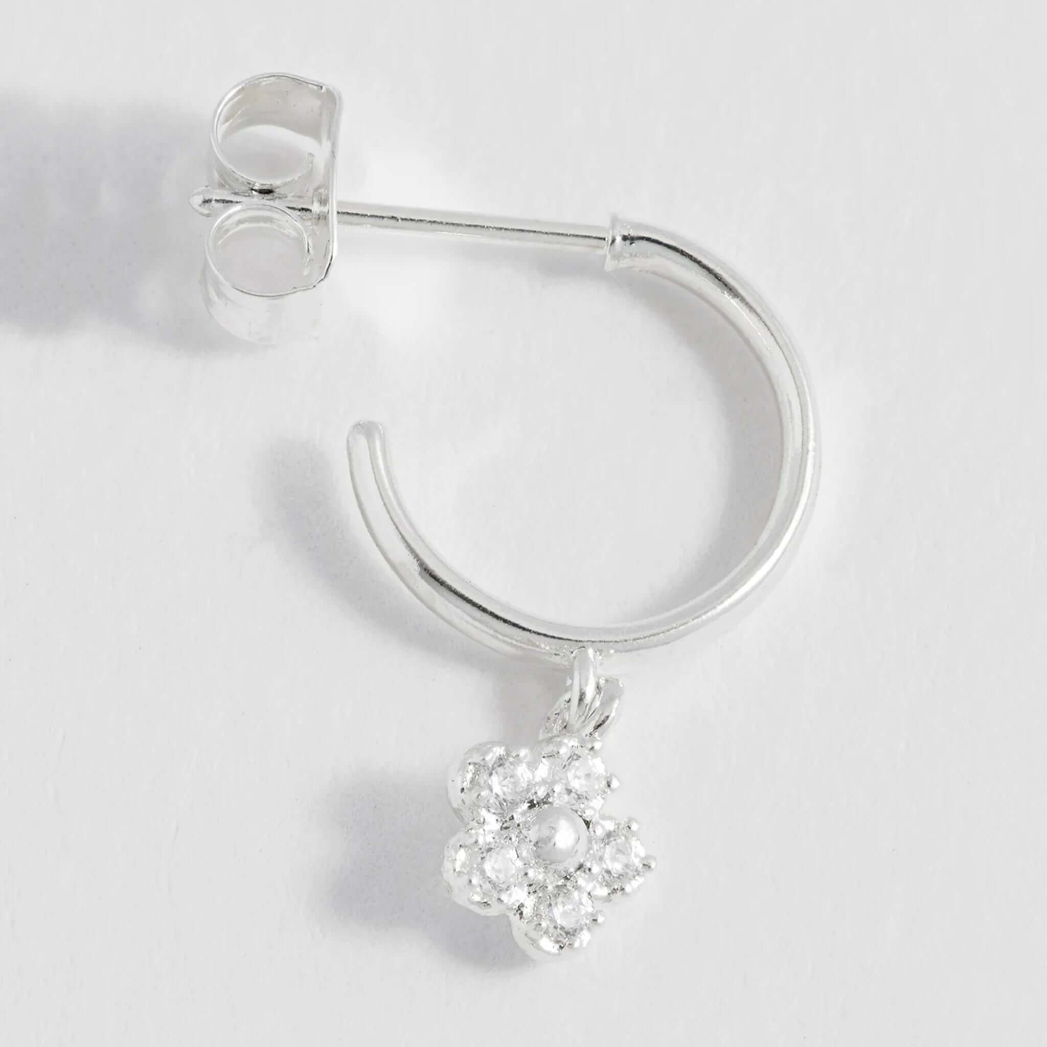 Alt Tag: Estella Bartlett Flower Hoop CZ Earrings - Silver delicate silver hoop earring with sparkling cubic zirconia flower charm