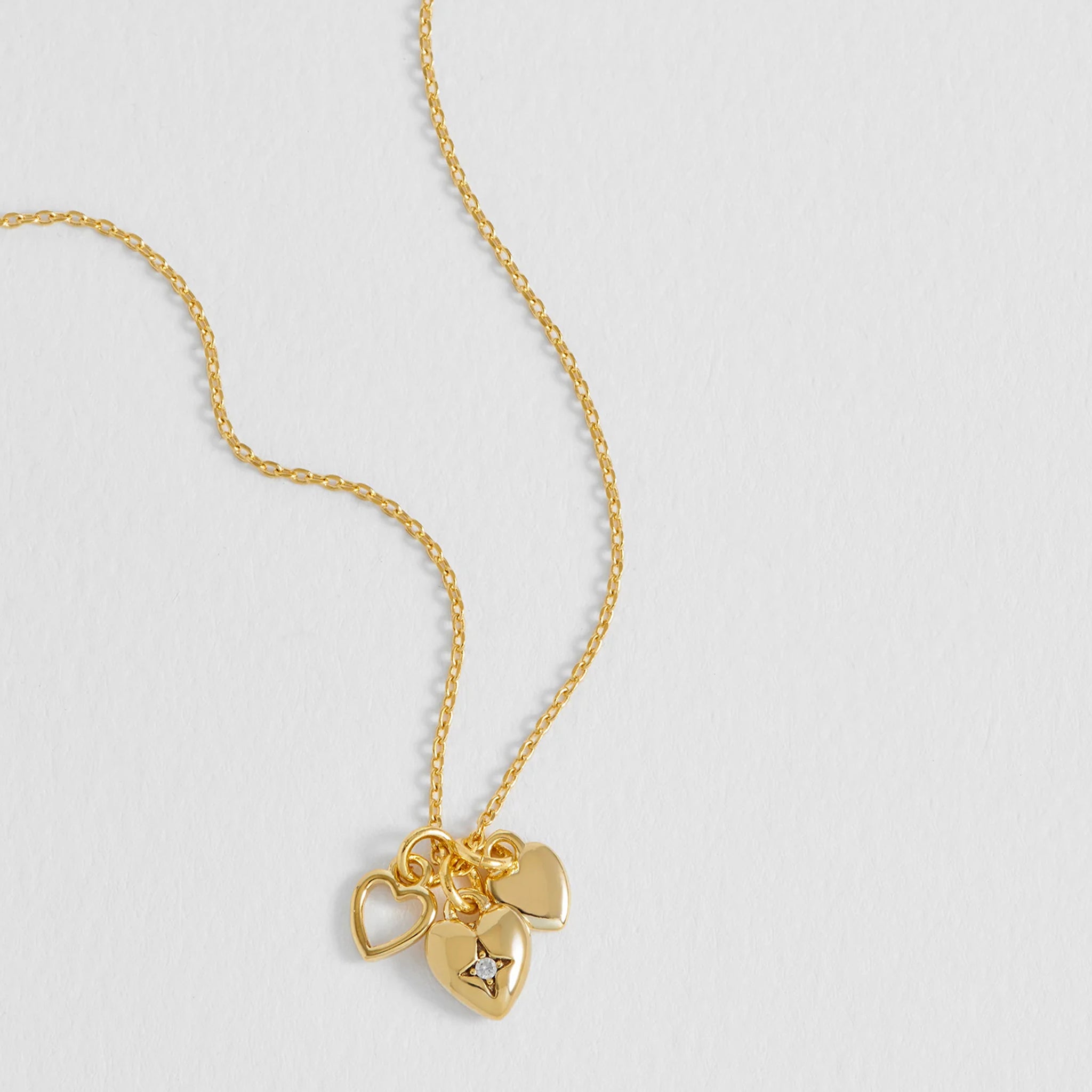 Estella Bartlett Triple Heart Charm Necklace