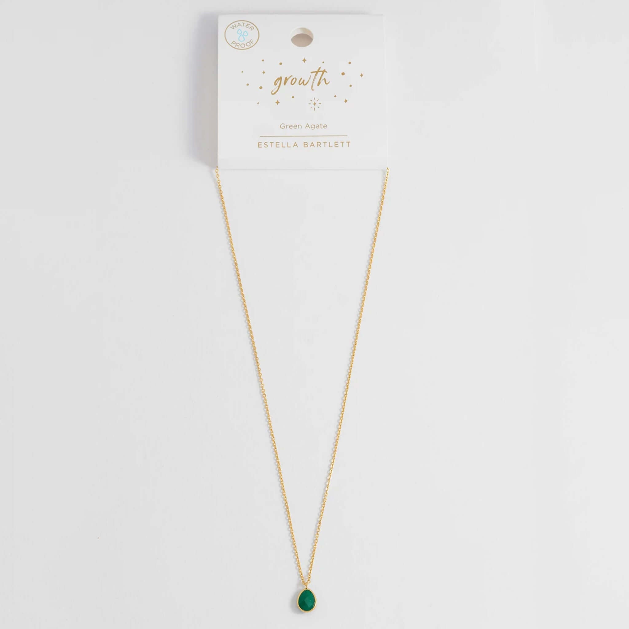 Estella Bartlett Wellness Faceted Teardrop Necklace - Green Agate on display with gold chain and green agate pendant.