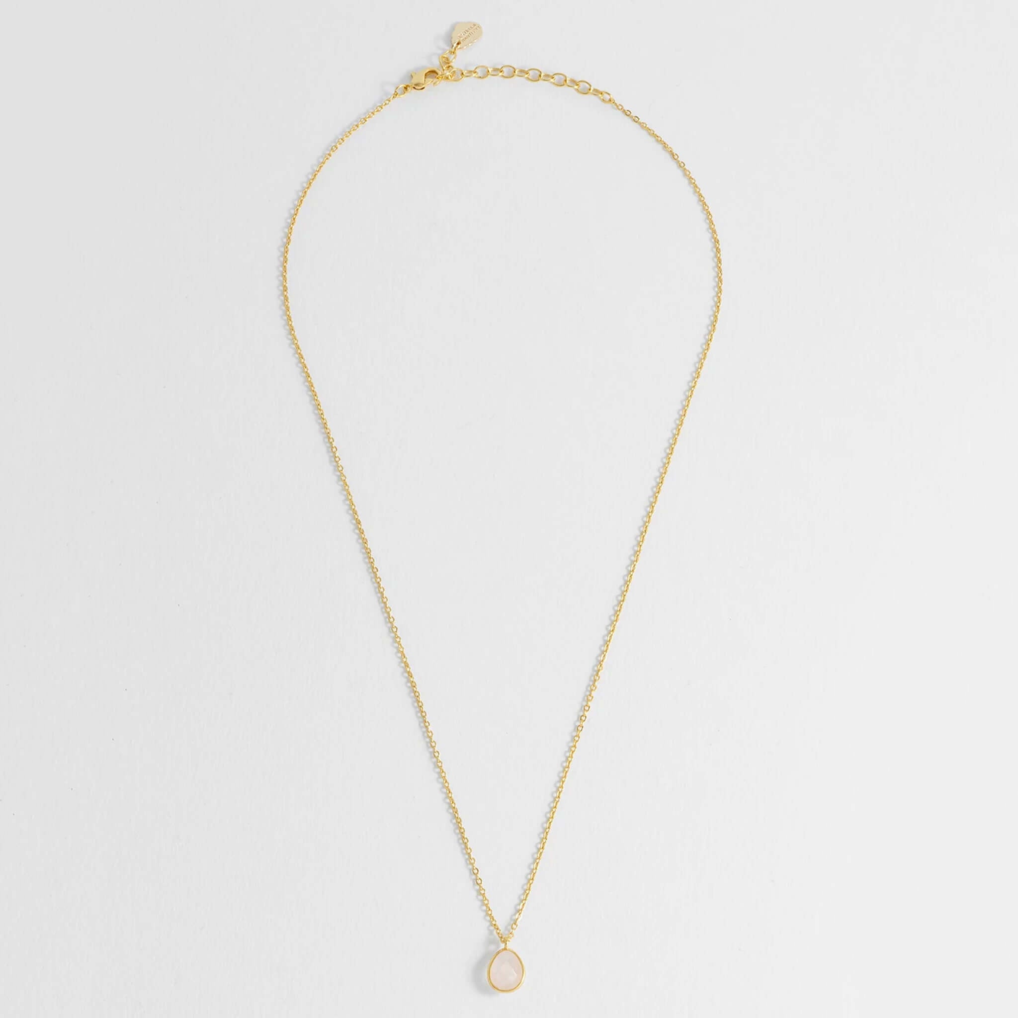 Estella Bartlett Wellness Faceted Teardrop Necklace - Rose Quartz with gold-plated chain and faceted pendant.