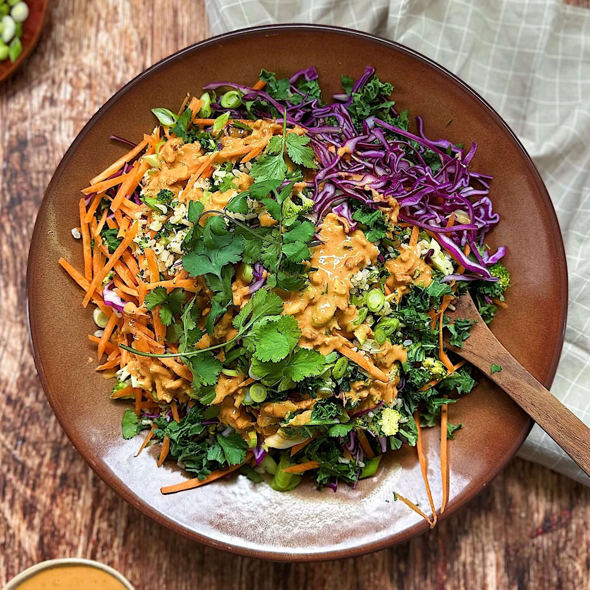 Alt Tag: Everything Salads: Autumn & Winter cookbook vibrant fall salad bowl with kale, carrots, purple cabbage, herbs and creamy dressing