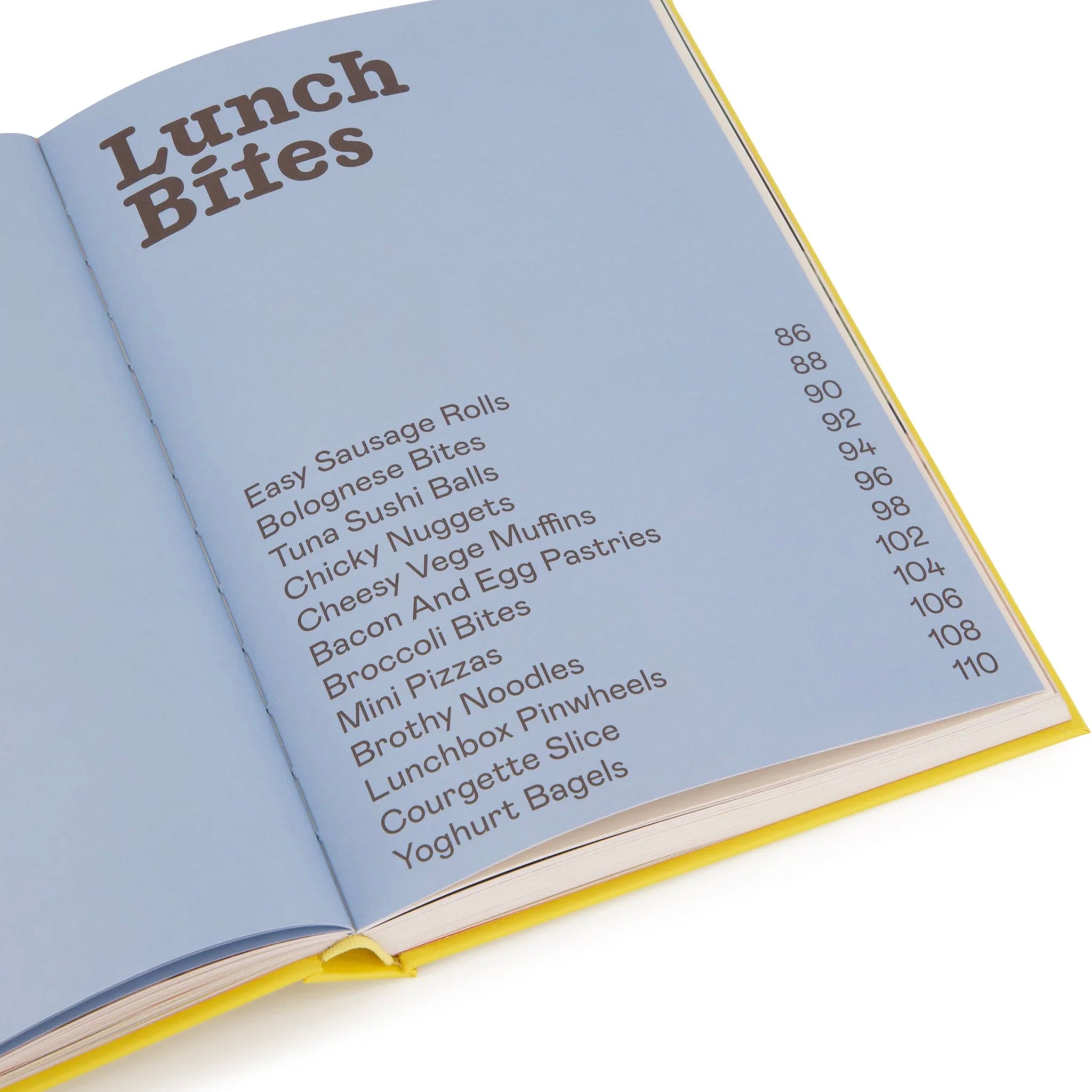 Open book showing a list of lunch items with a blue cover and yellow edges.