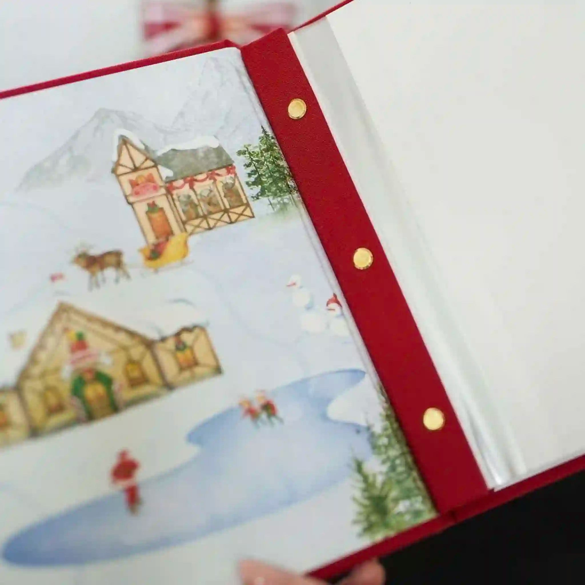 Decorative book with a winter scene illustration on a white background