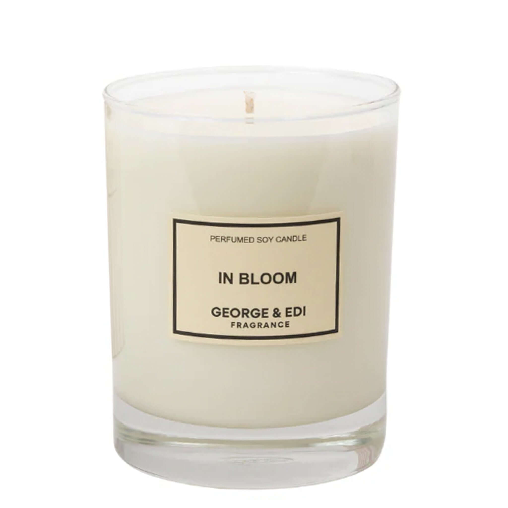 George & Edi In Bloom candle in a glass container, showcasing its natural soy wax and elegant design.