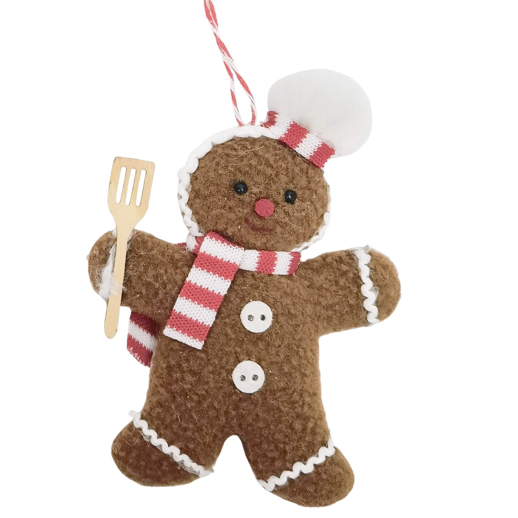 Decorative gingerbread man ornament with a chef's hat, spatula, and scarf on a white background
