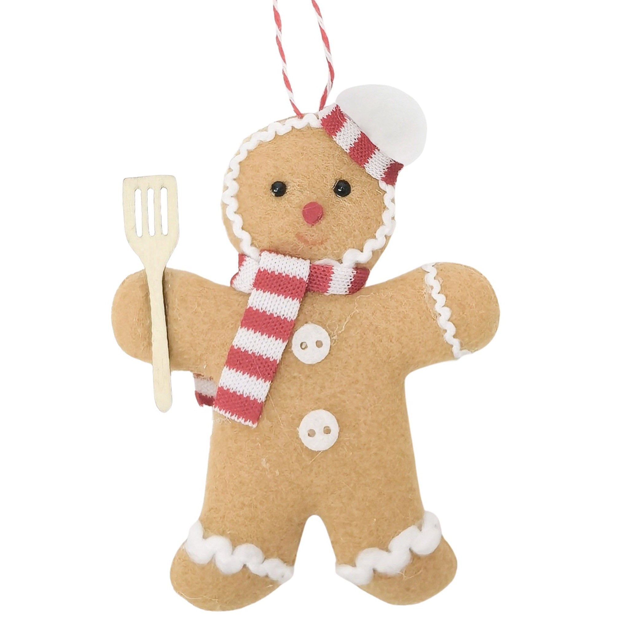 Gingerbread man ornament with a spatula on a white background