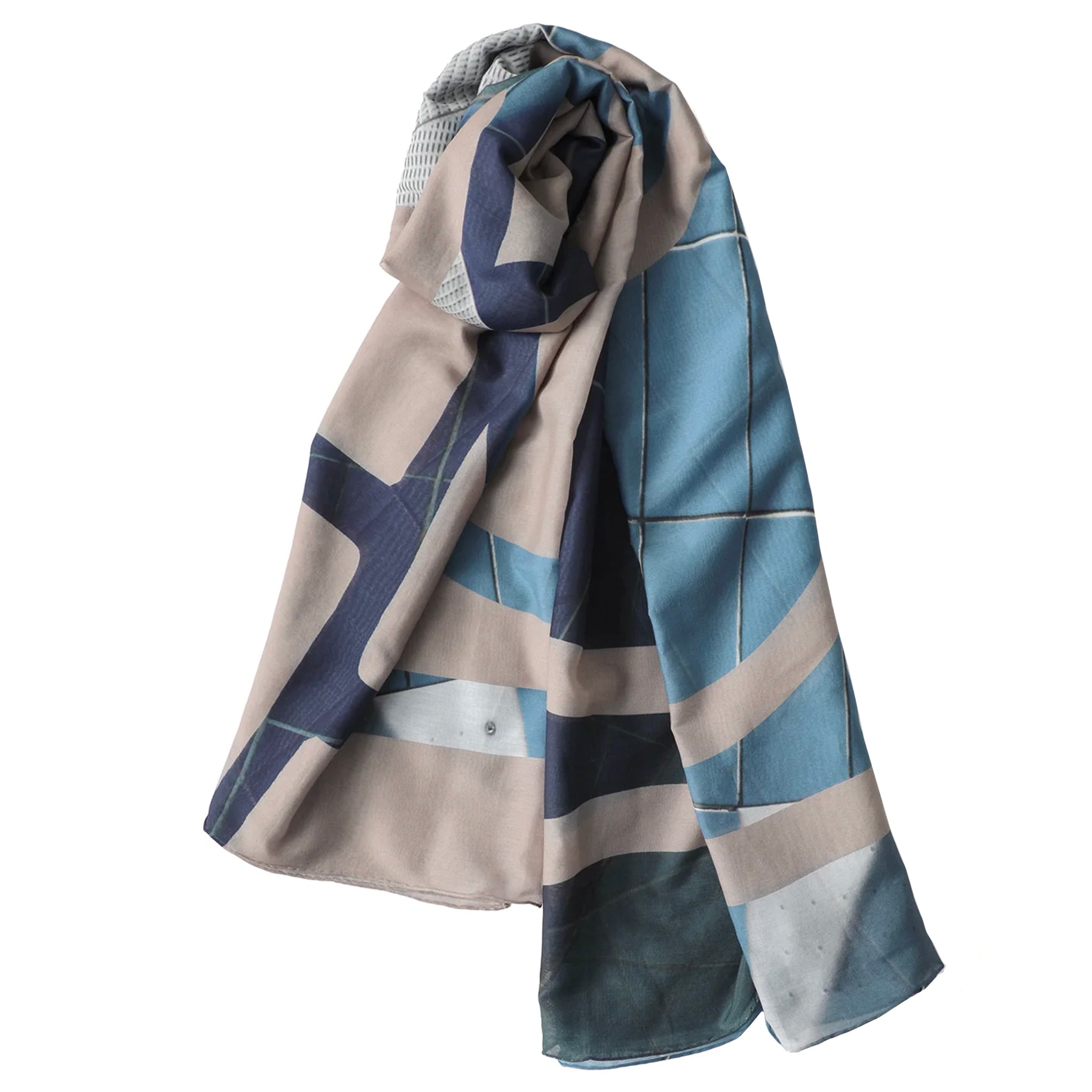 Folded fabric with blue and beige pattern on a white background