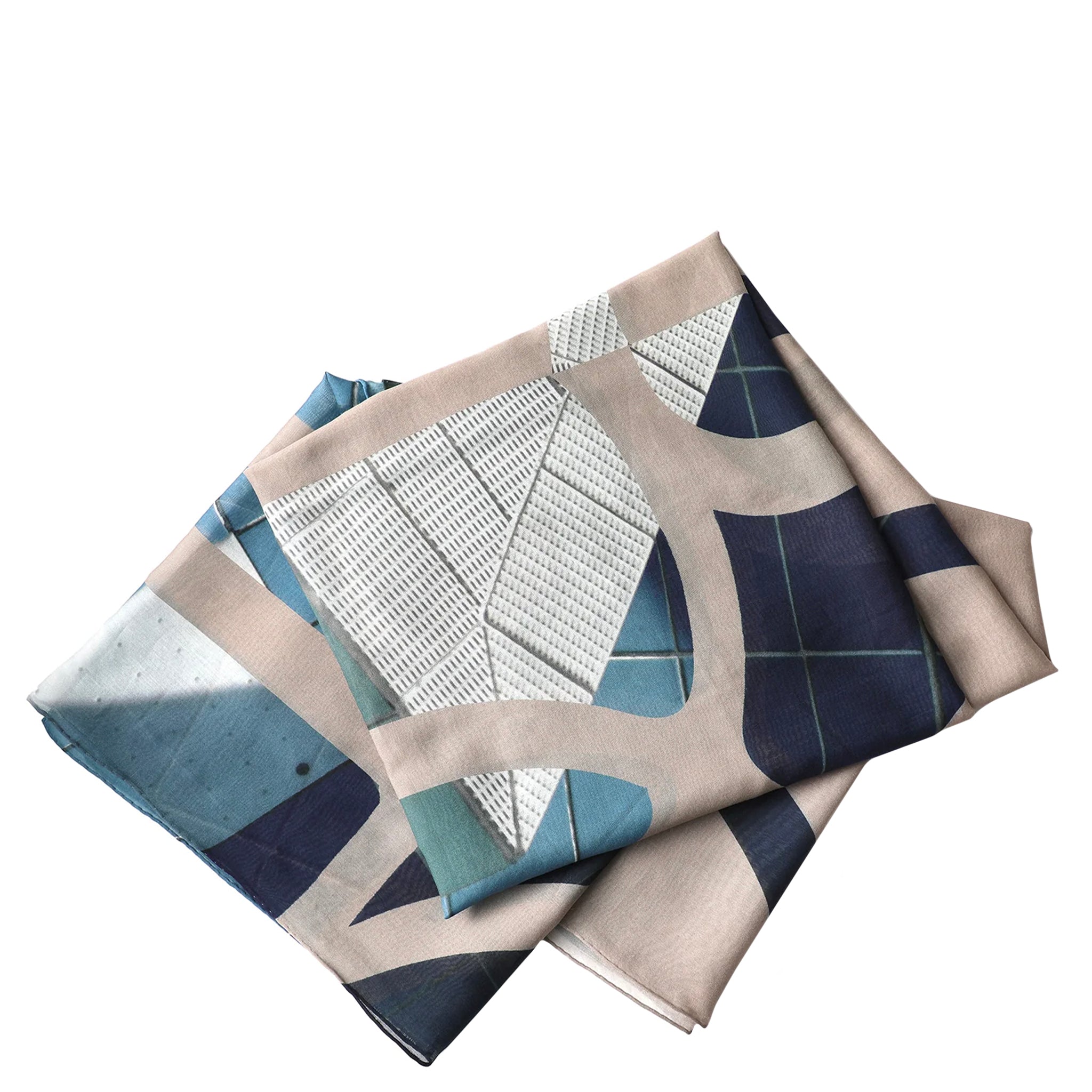 Set of folded fabric napkins with geometric patterns on a white background